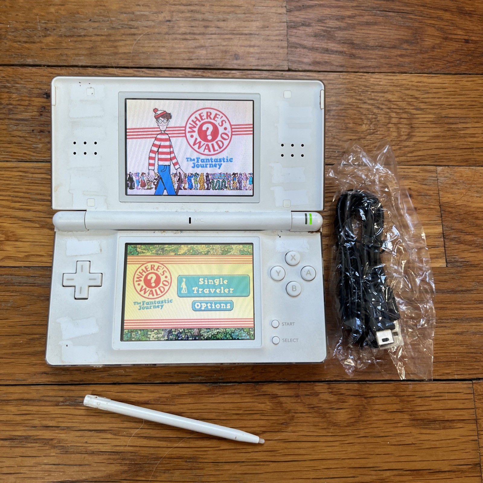 Nintendo DS Lite Handheld Console – Polar White and game charger stylus works