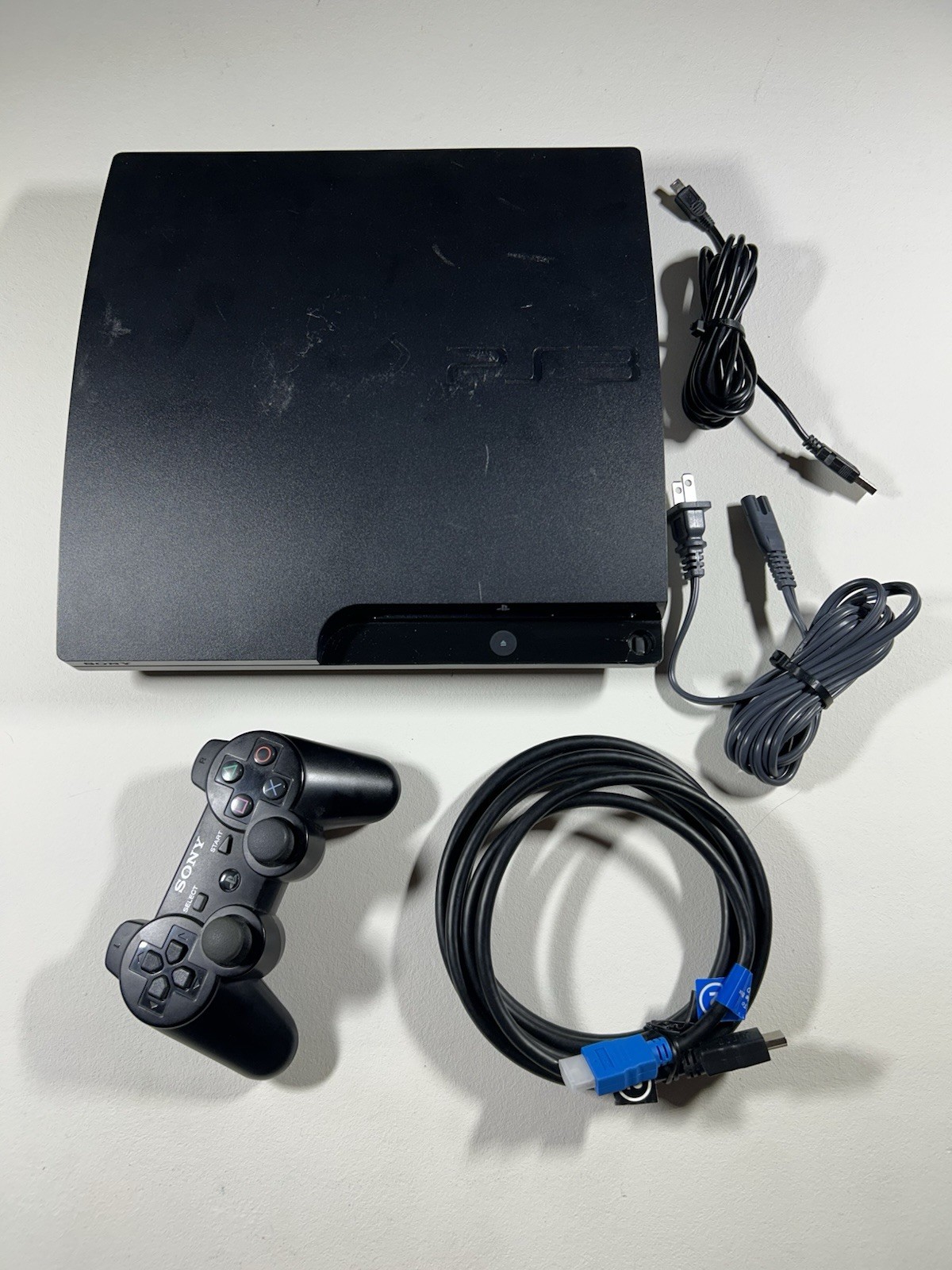 Sony Playstation PS3 Slim CECH-3001B 300gb (Controller Only Works on cord) Testd