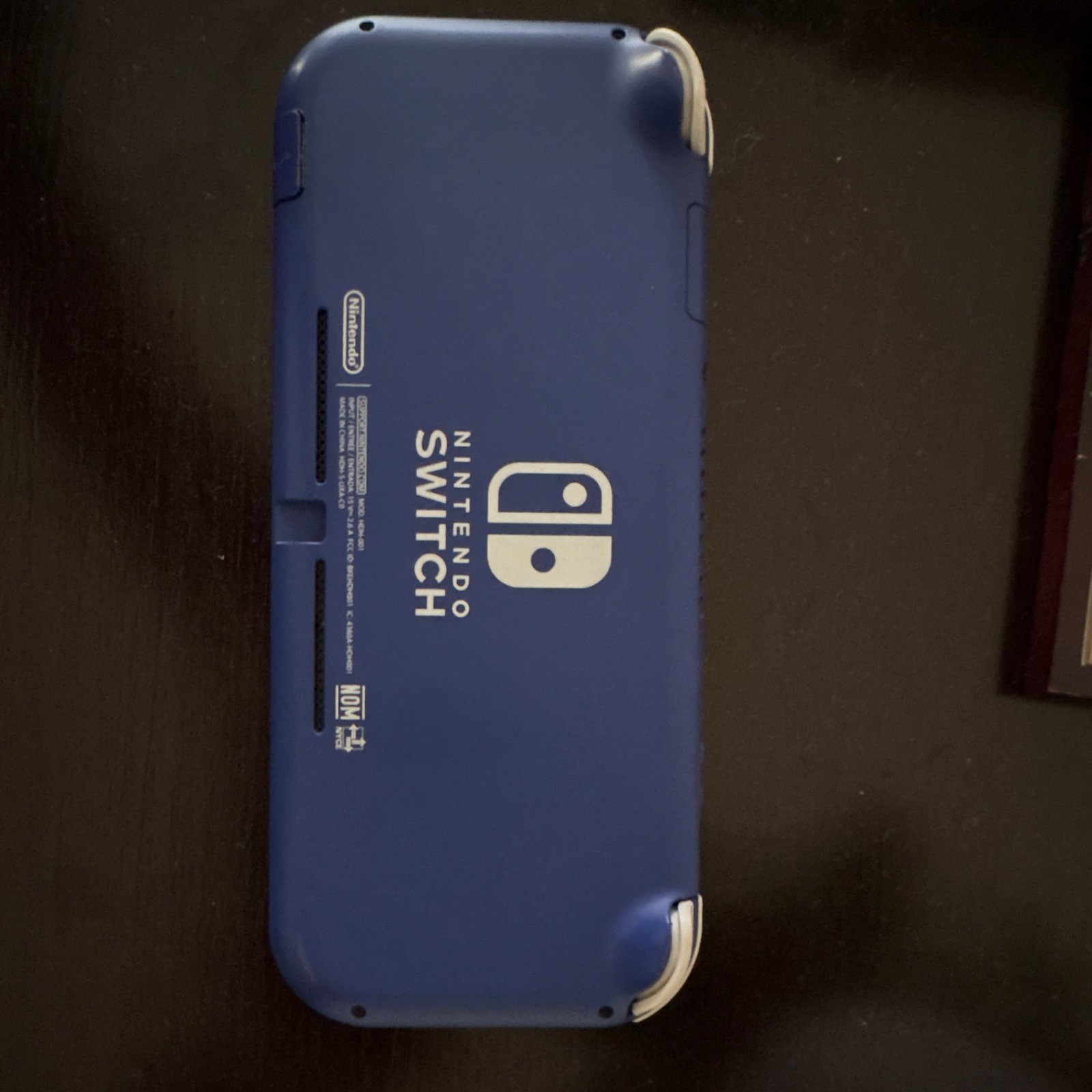 Nintendo Switch Lite Blue + Carrying case + Game
