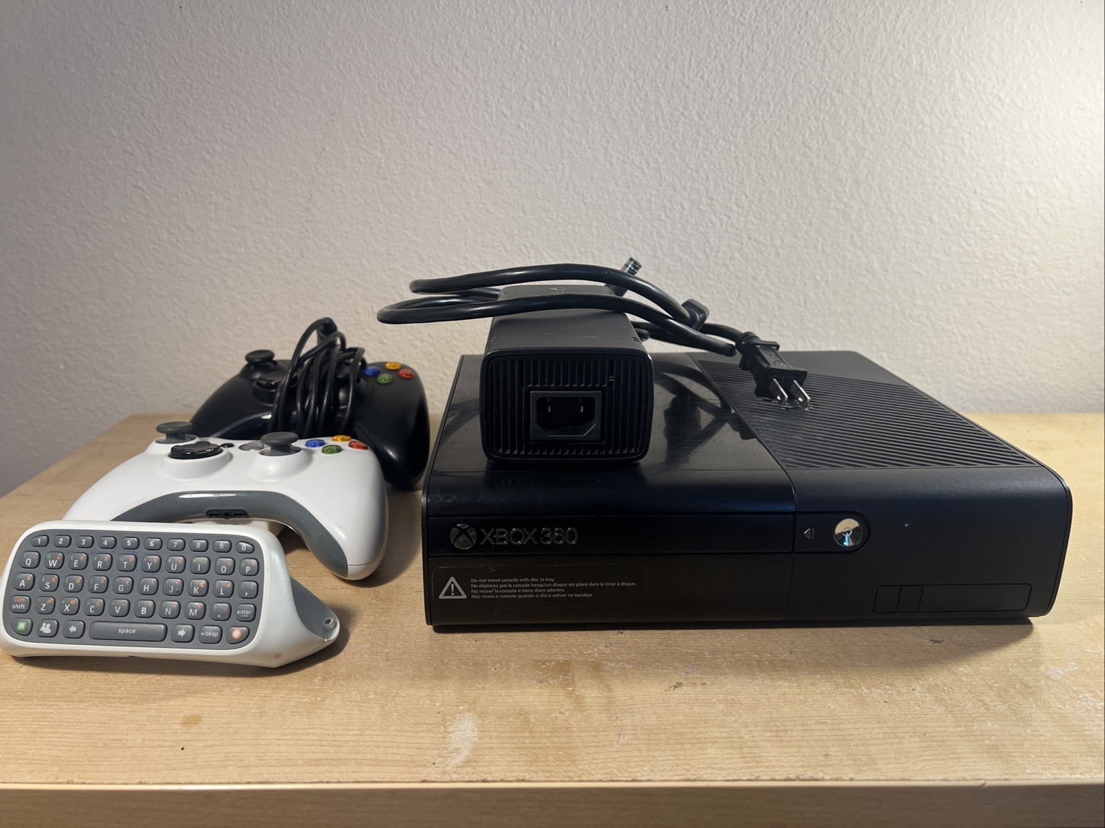 Xbox 360 E 4GB Black With One Wired And Wireless Controller And Charpad