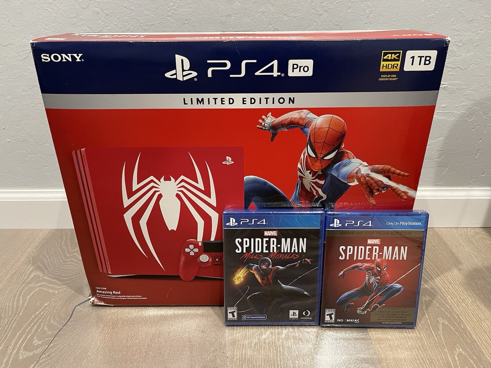 Sony PlayStation 4 Pro PS4 1TB Spiderman Edition Console Bundle with Two Games!