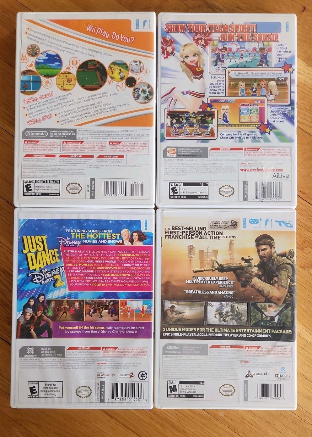 Nintendo Wii Console Bundle: 2 Remotes 2 Nunchucks, All Cords, 4 Games & Stand