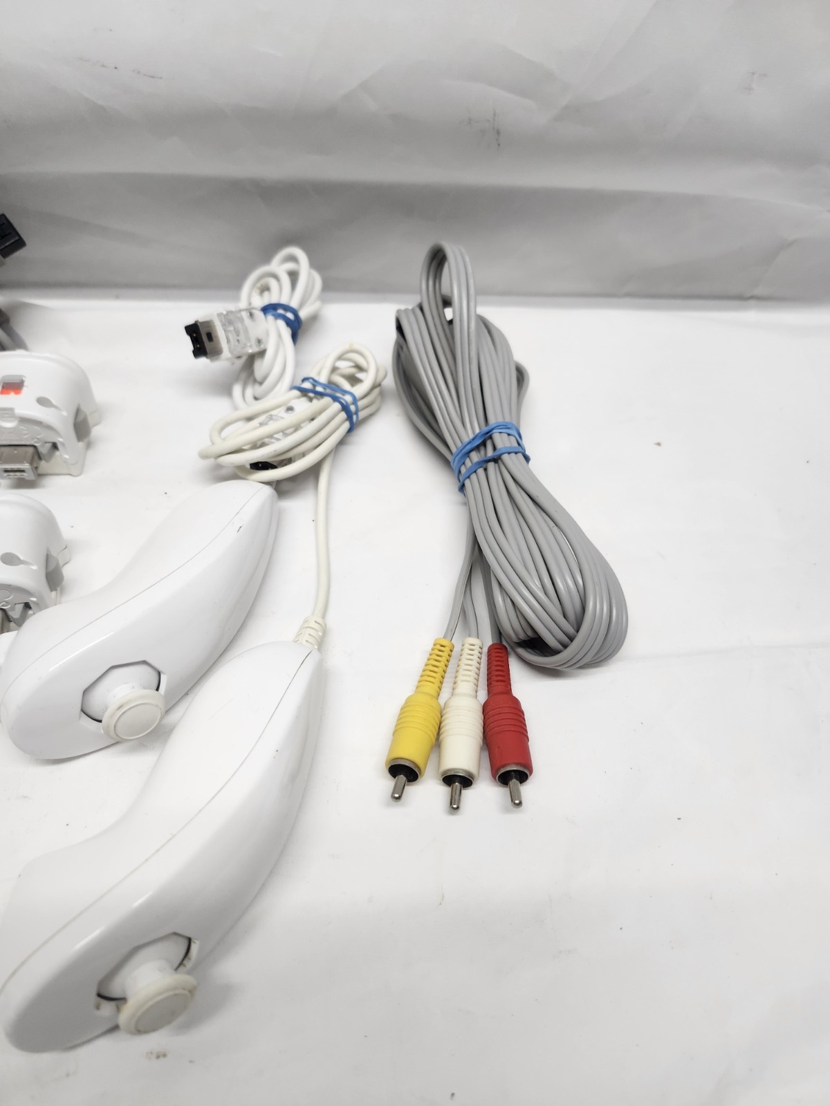 Nintendo Wii Console Bundle (2) Controllers, Motion Plus, Game Nunchuck, & Cords