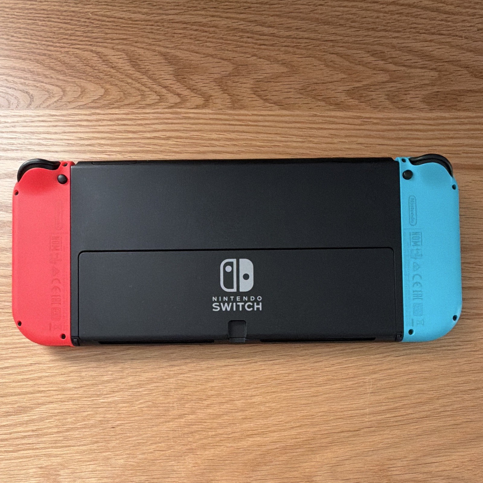 Nintendo Switch V2 OLED Console w/ Red/Blue Joy-Con + NYXI Purple Controller