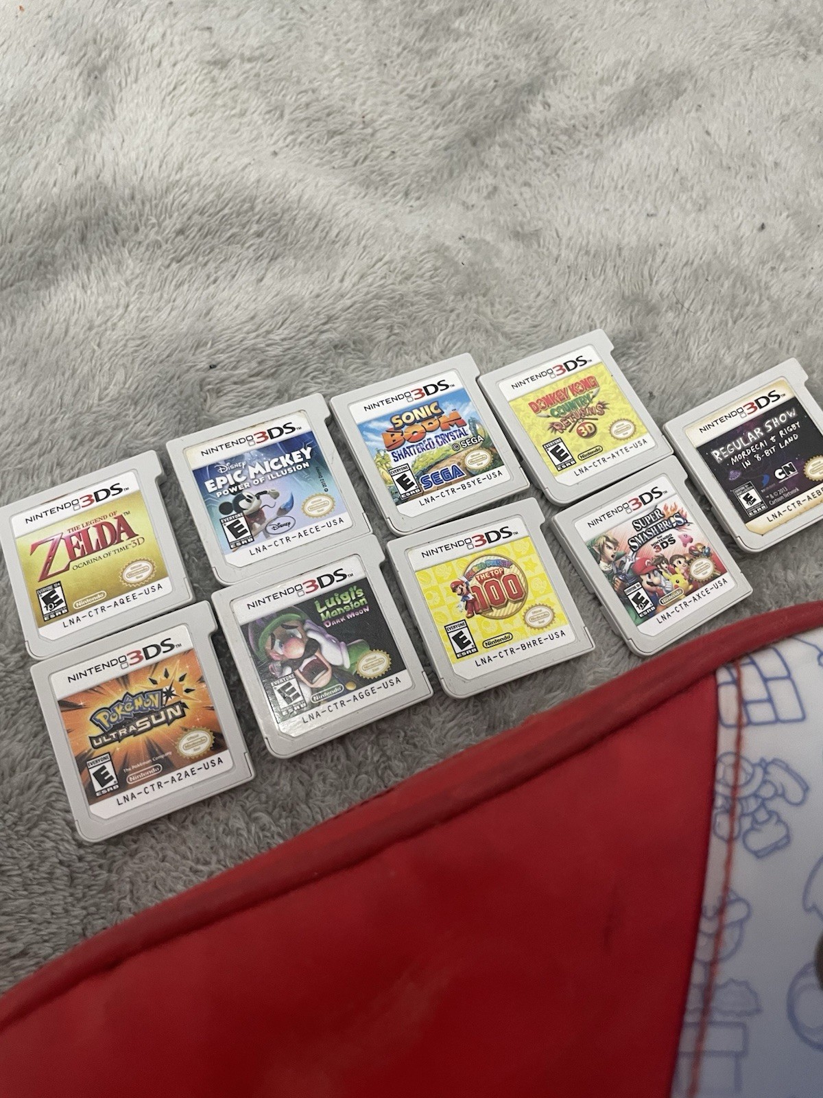 Nintendo 3DS XL (Red) with pouch and lots of games