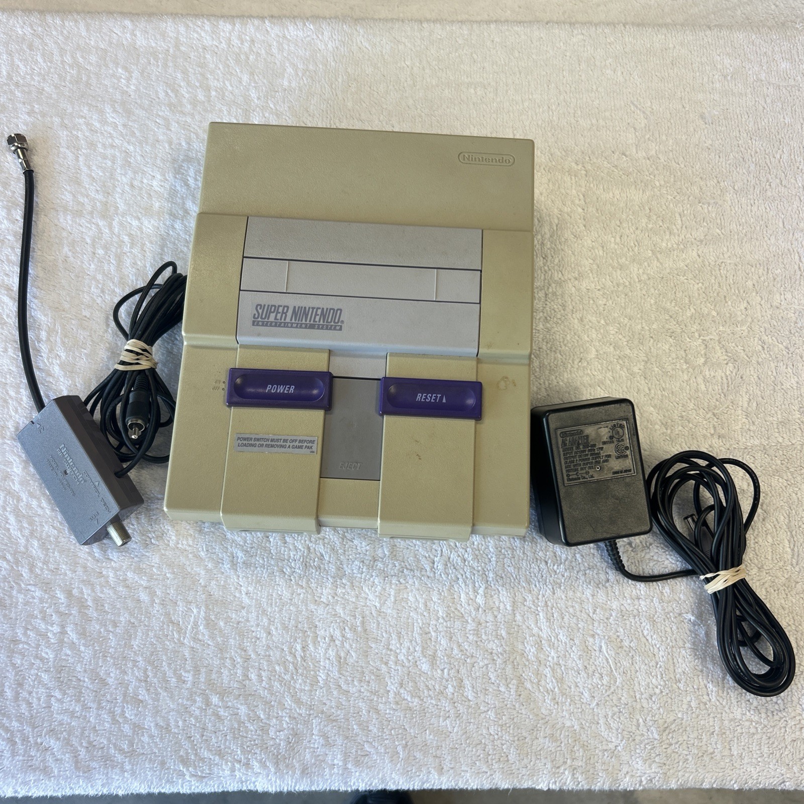 Super Nintendo console only. Includes RF Switch And Power Supply.