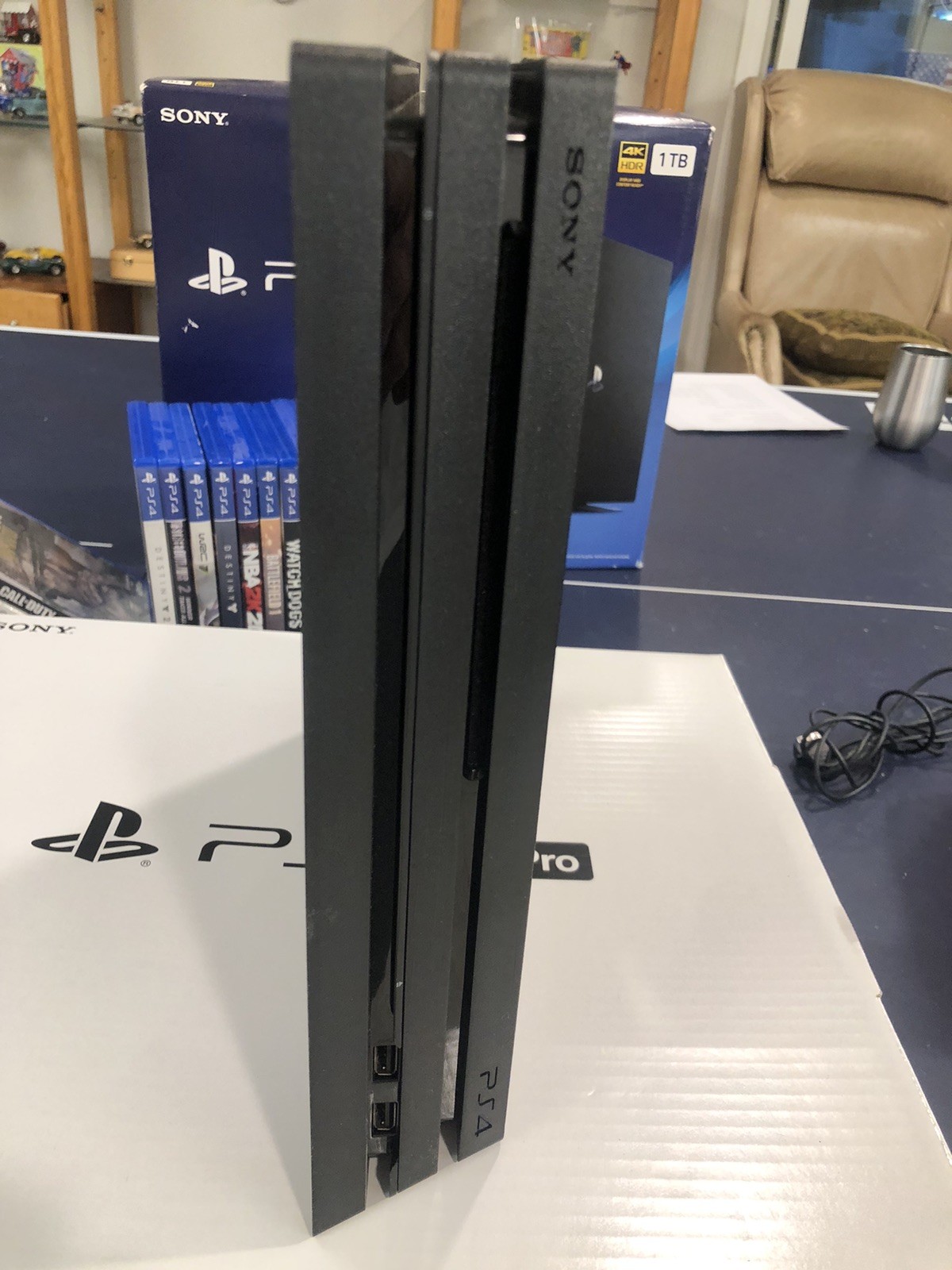 SONY PS4 4K HDR 1 TB – Includes 2 Controllers & 15 Classic Games