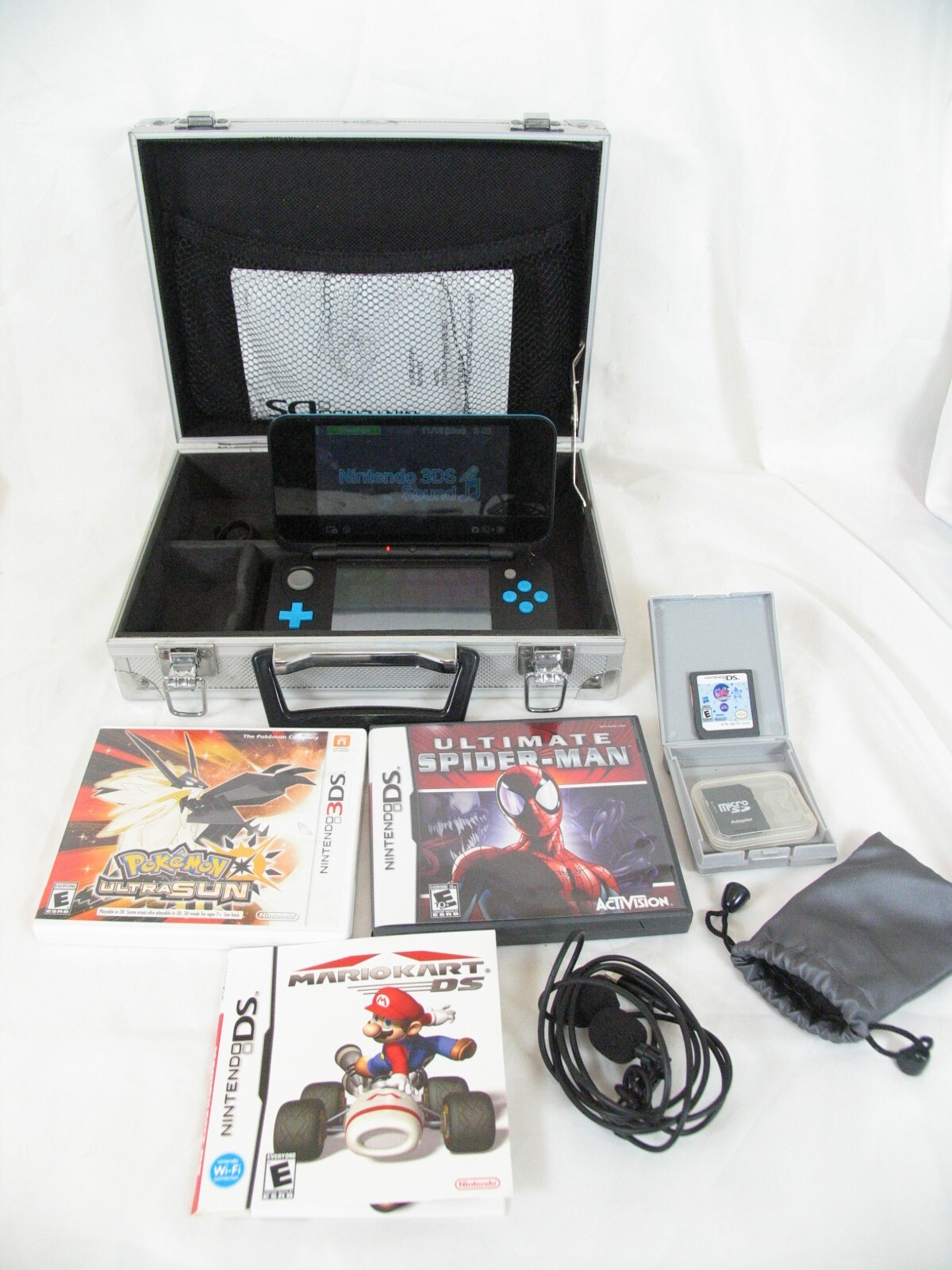 Nintendo 3DS Jan-001 Blue/Black W/ Pokémon Ultra Sun, Spiderman, Pet Shop & Dogs