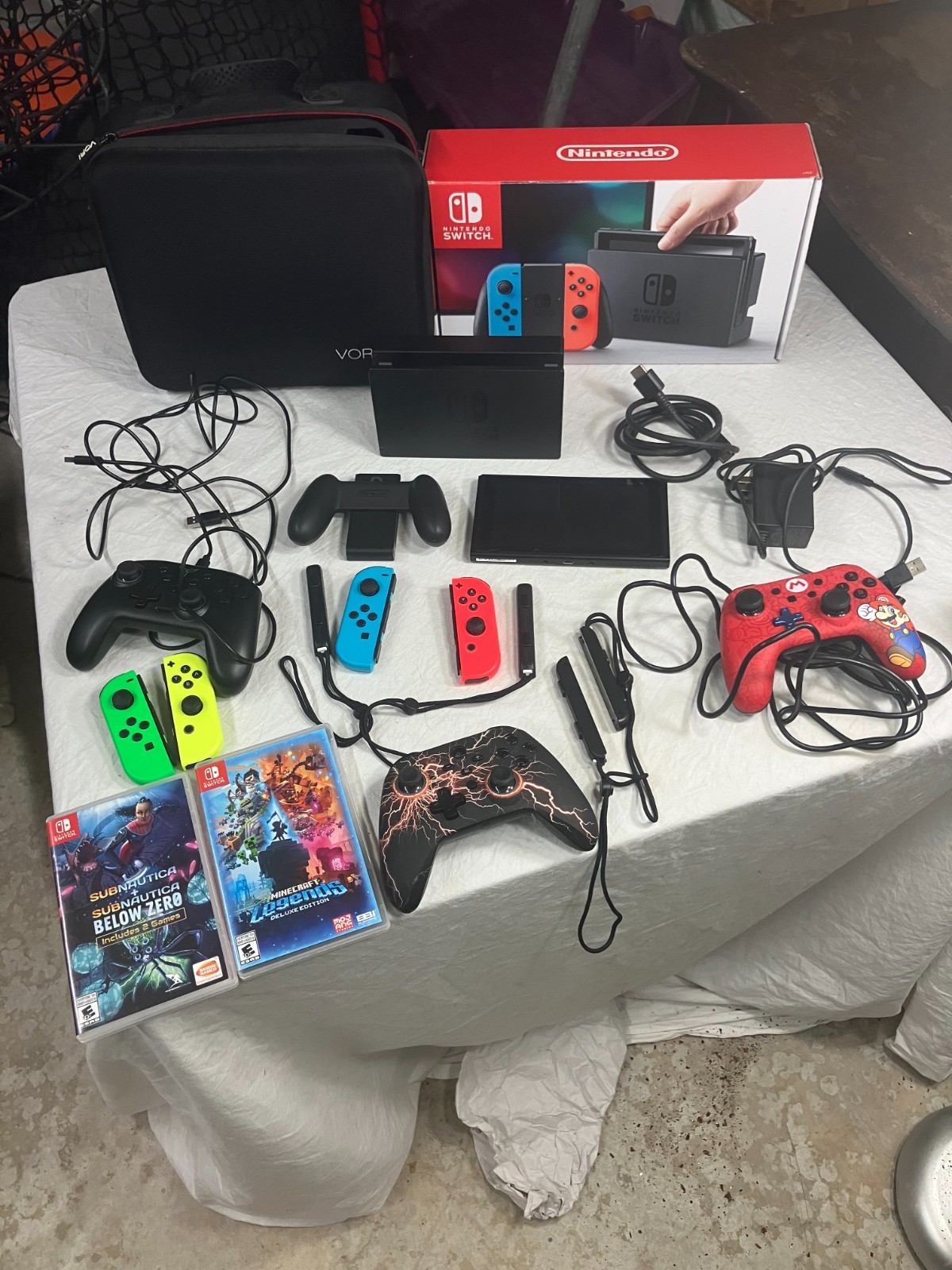 Nintendo Switch 32GB Gray Console with Games, Controllers, and Case Bundle.