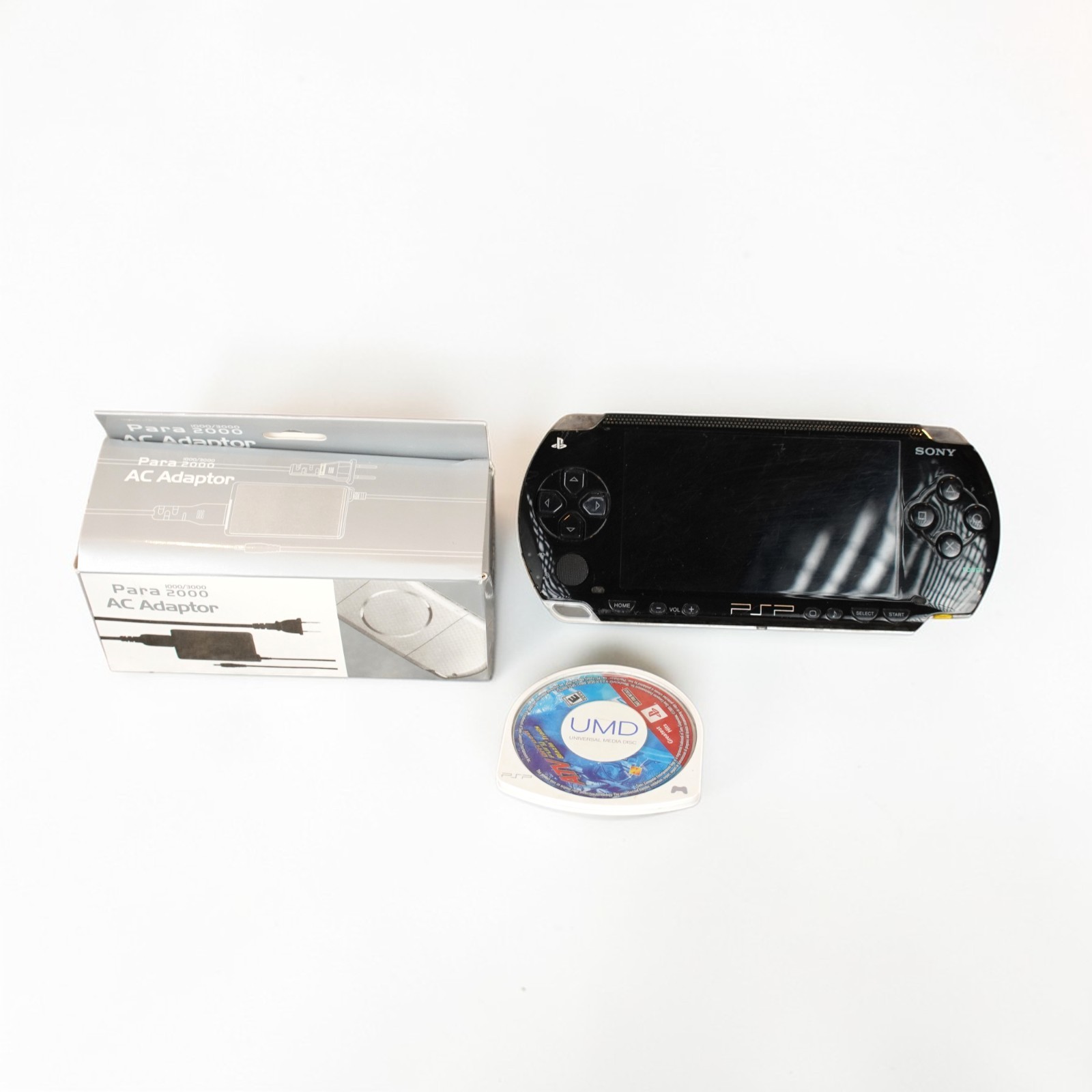 Sony PSP-1001 Handheld Console Black W/ Charger 32MB Stick New Battery Game Disc