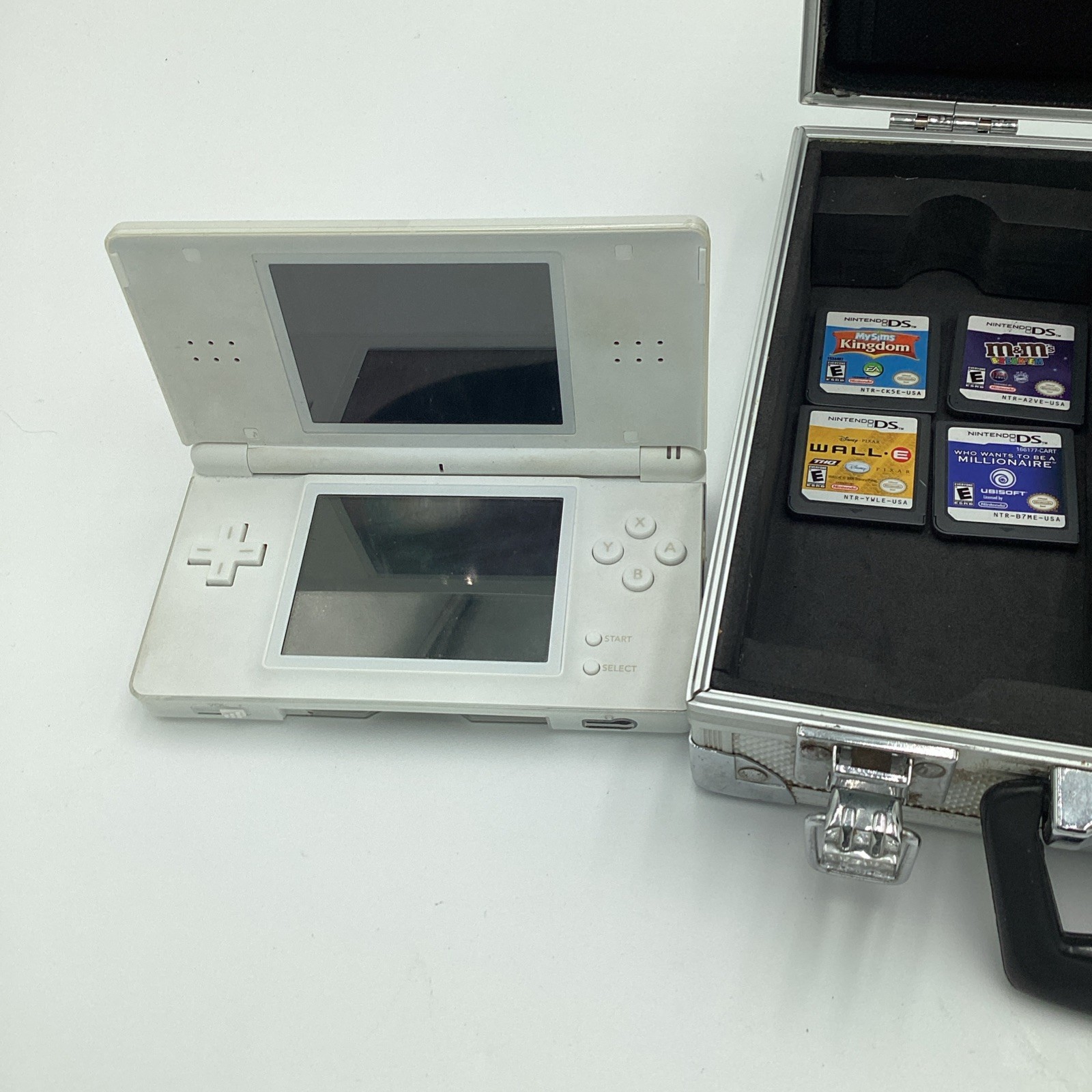 Nintendo DS Lite Lot Complete With Four Games, Charger, Stylus And A Metal Case