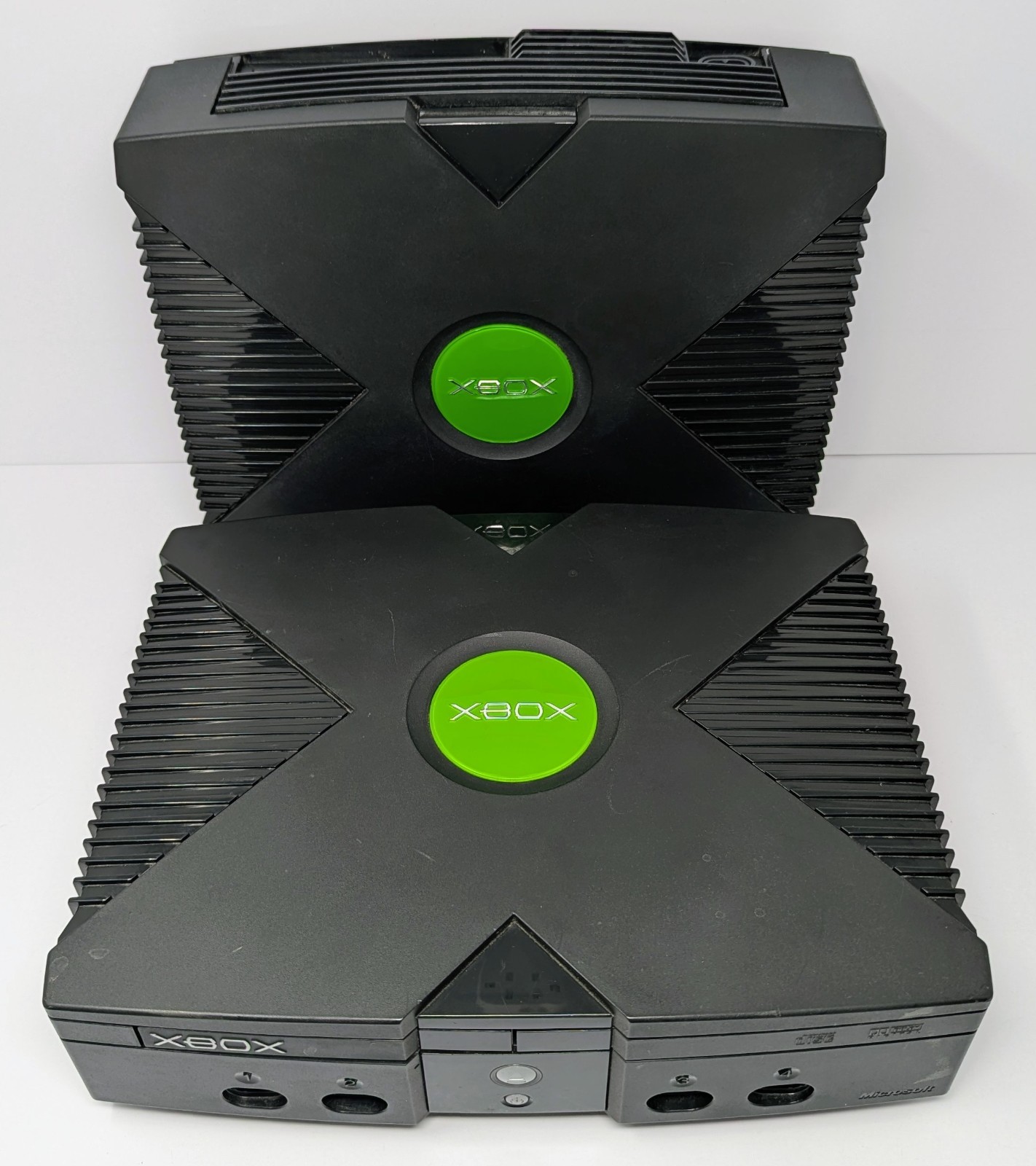 2 Original Microsoft Xbox Consoles – Powers On – For Parts Or Repair