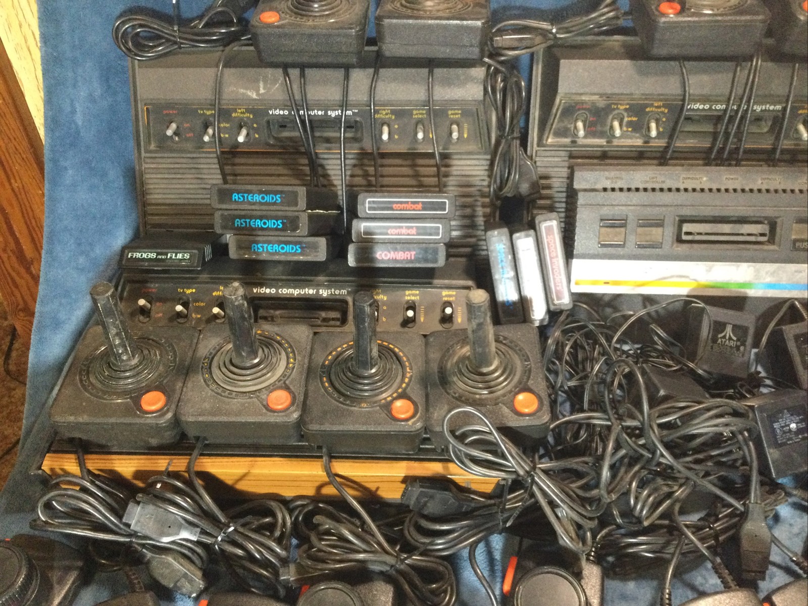 LOT(4) ATARI 2600 CONSOLES (42)GAMES (21)CONTROLLERS (4)AC ADAPTERS UNTESTED!!