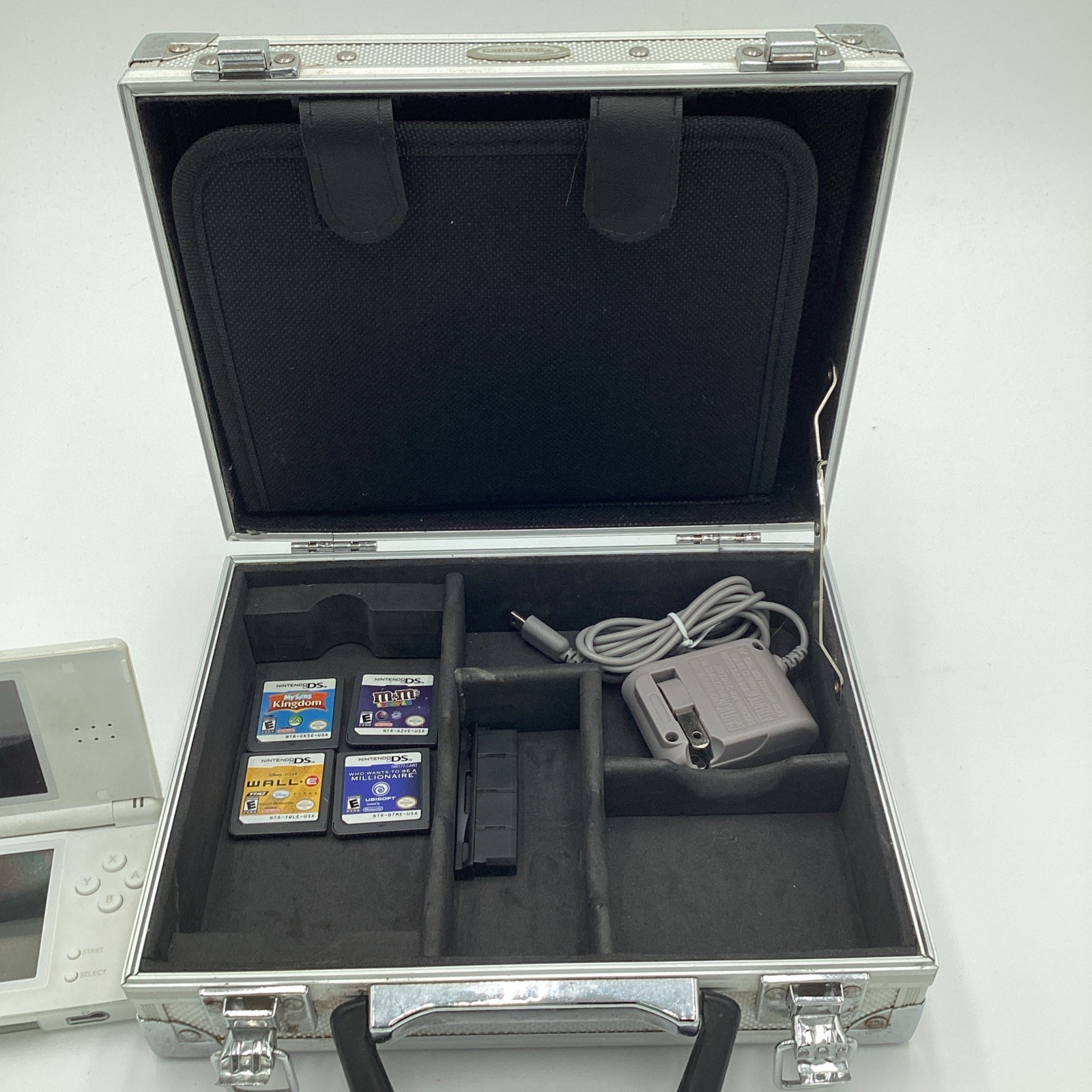Nintendo DS Lite Lot Complete With Four Games, Charger, Stylus And A Metal Case