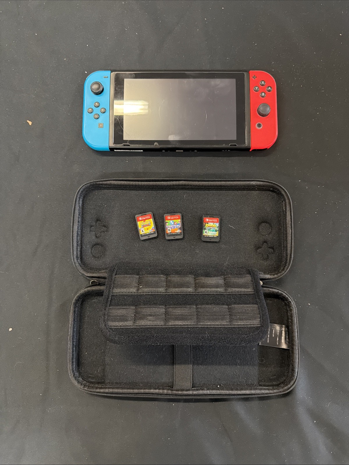 Nintendo Switch 32GB Console with Neon Red and Neon Blue Joy-Con, Case & Games