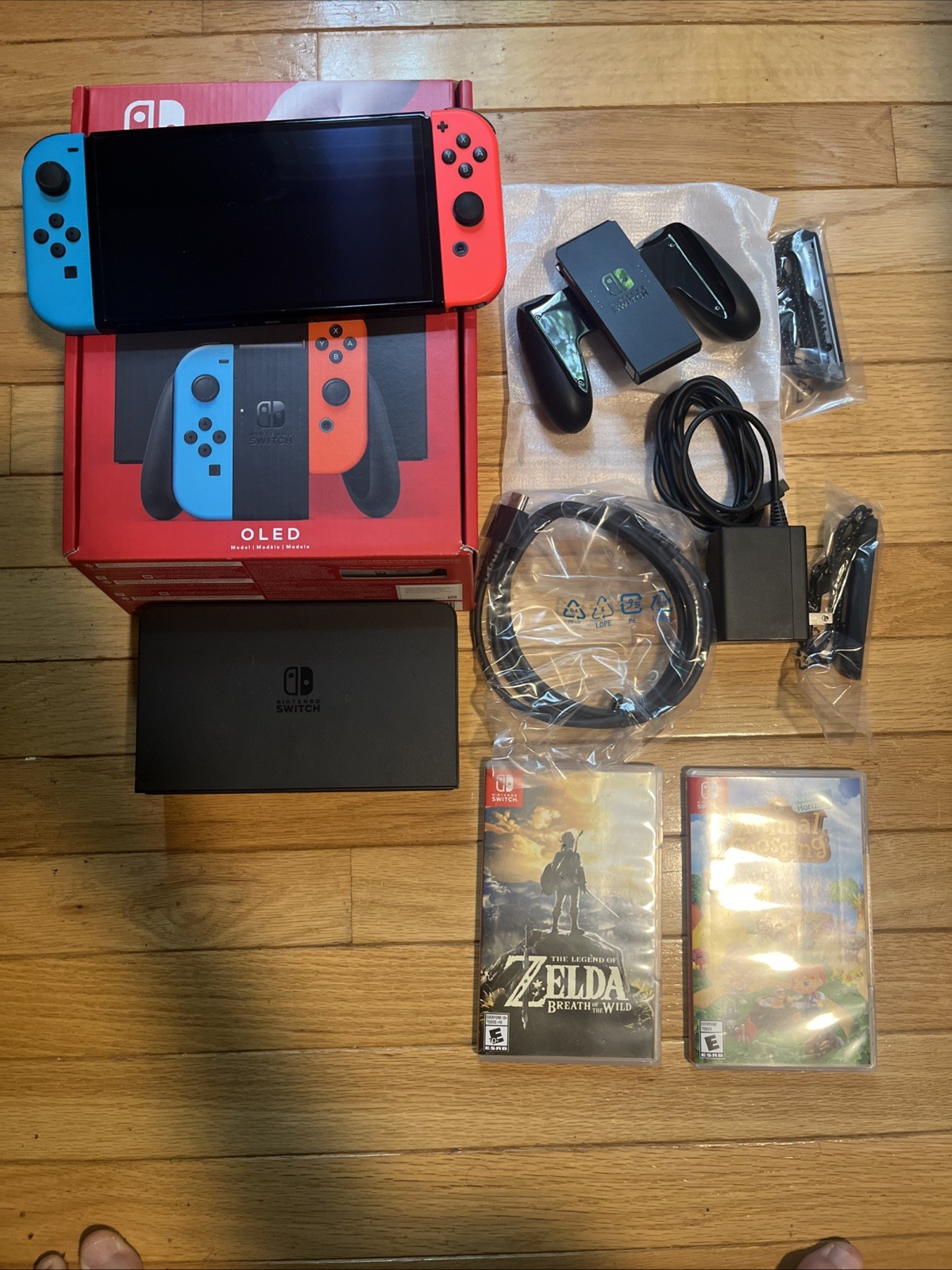 Nintendo Switch OLED Bundle With Animal Crossing And Zelda Breath Of The Wild
