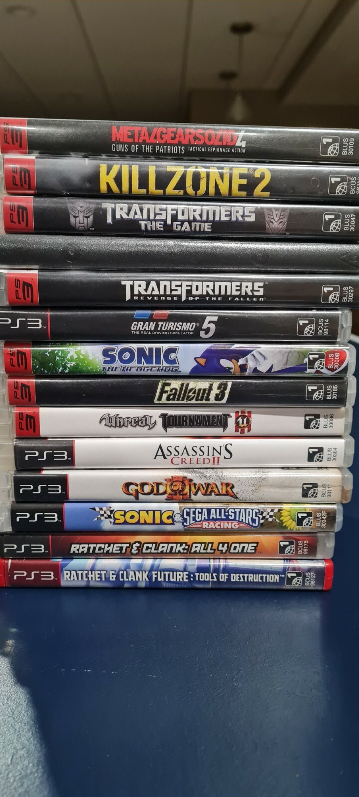 *adult owned rarely used* ps3 slim with controller ,original cables and 14 games