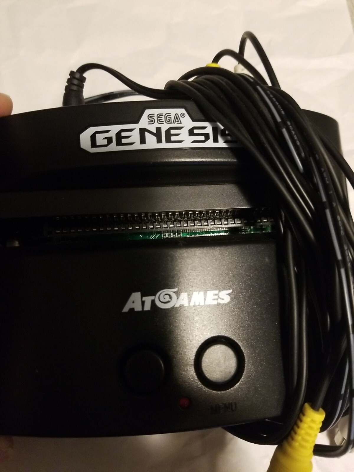At Games Sega Genesis Classic Console With 2 controller and 40 games Built in.