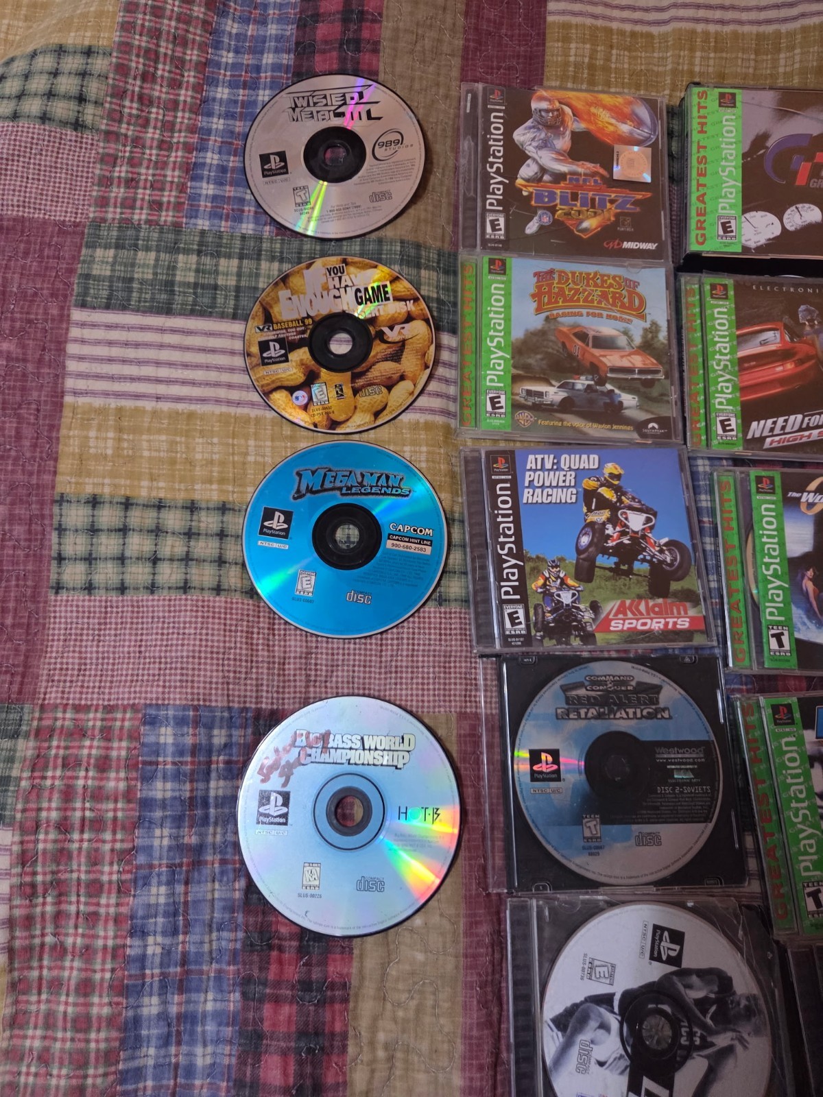 PlayStation 1 with various games tested in working condition has 2 controllers
