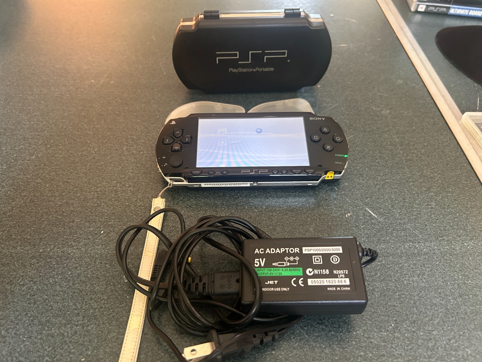 Sony PlayStation Portable console PSP-1004 with 8 games & 3 memory sticks
