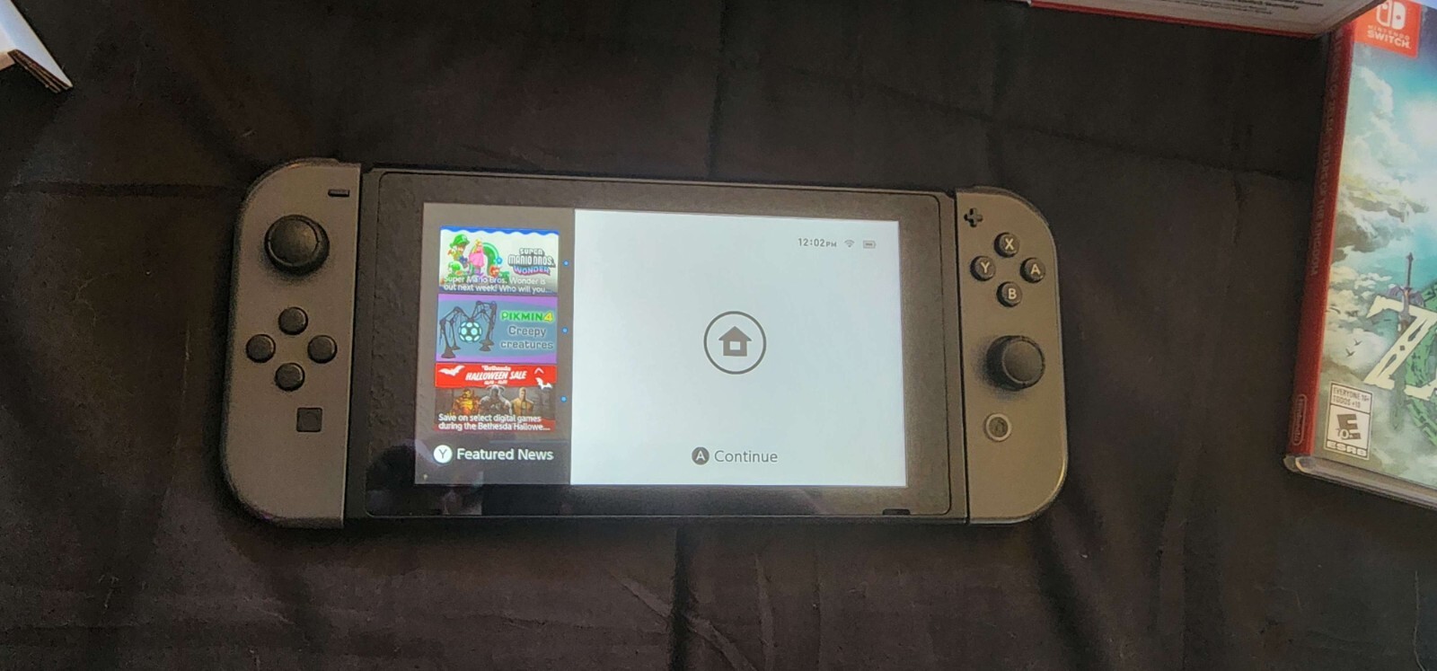 Nintendo Switch In Box – With Tears of the Kingdom and Pokemon: Lets GO Eevee