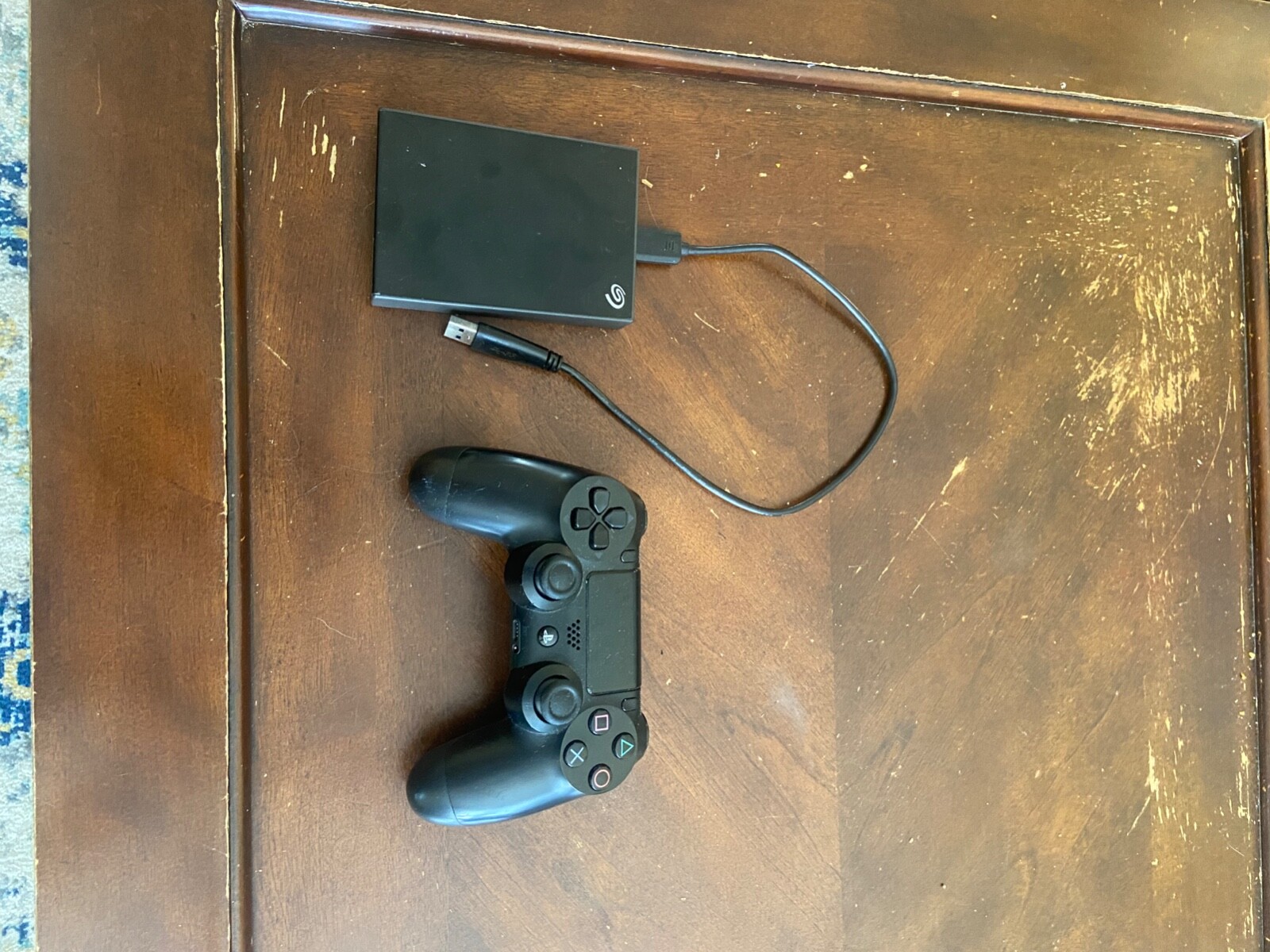 sony ps4 slim 500gb console with controller, 4tb external hard drive, and 4 game