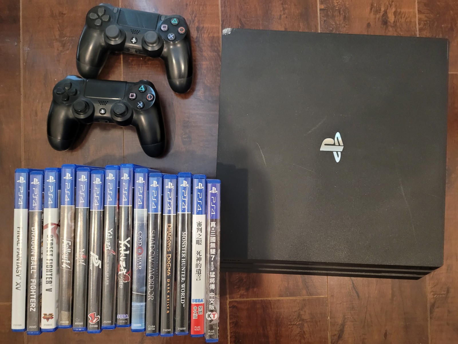 Sony PlayStation 4 Pro bundle with controllers and games