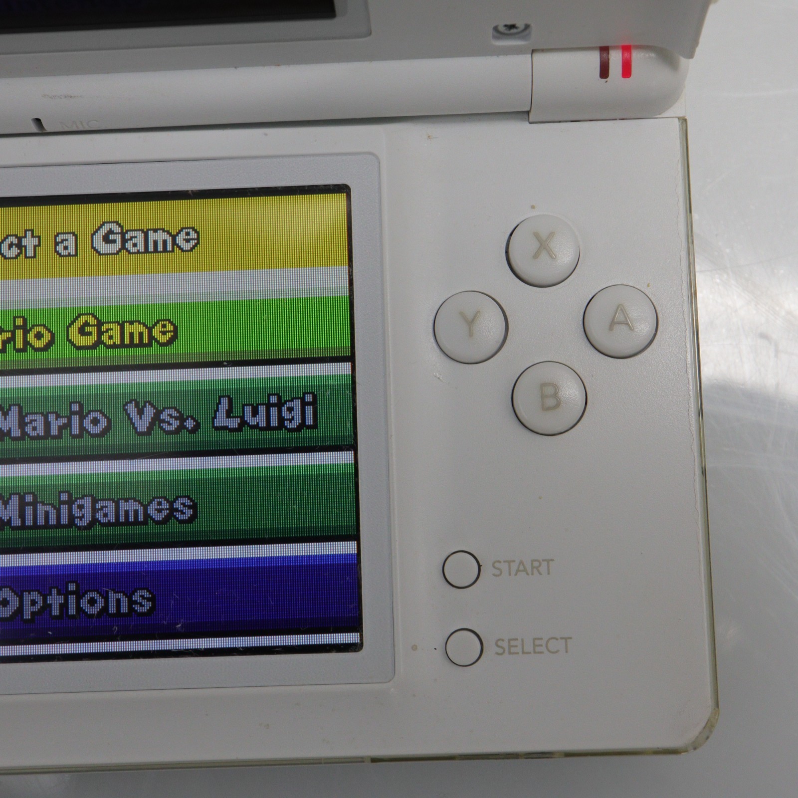 Nintendo DS Lite (USG-001) Handheld with 6 Games & Carrying Pouch – Polar White