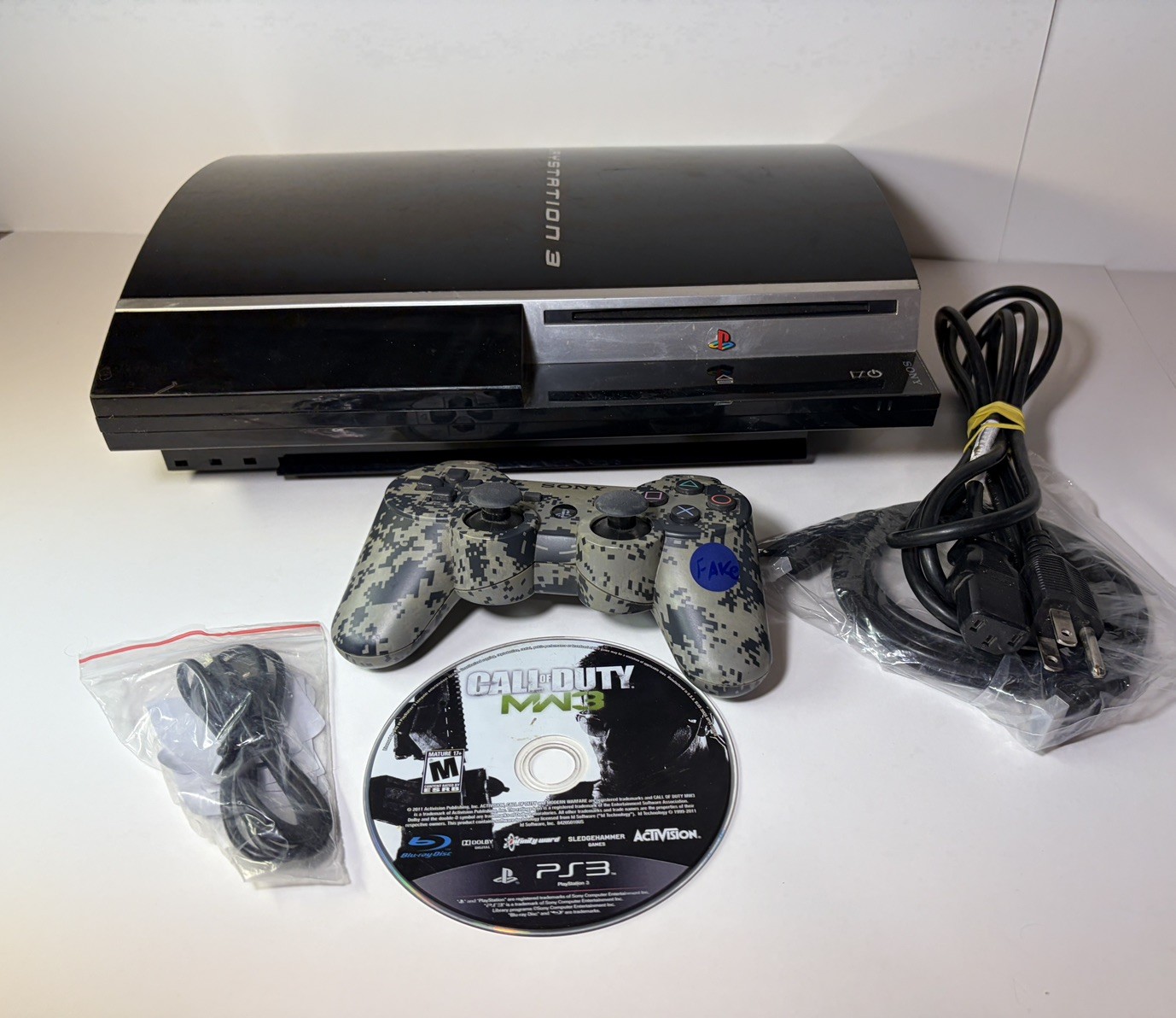 Sony PlayStation 3 PS3 Fat CECHH01 80GB Console – Game, Cables, Fake Controller