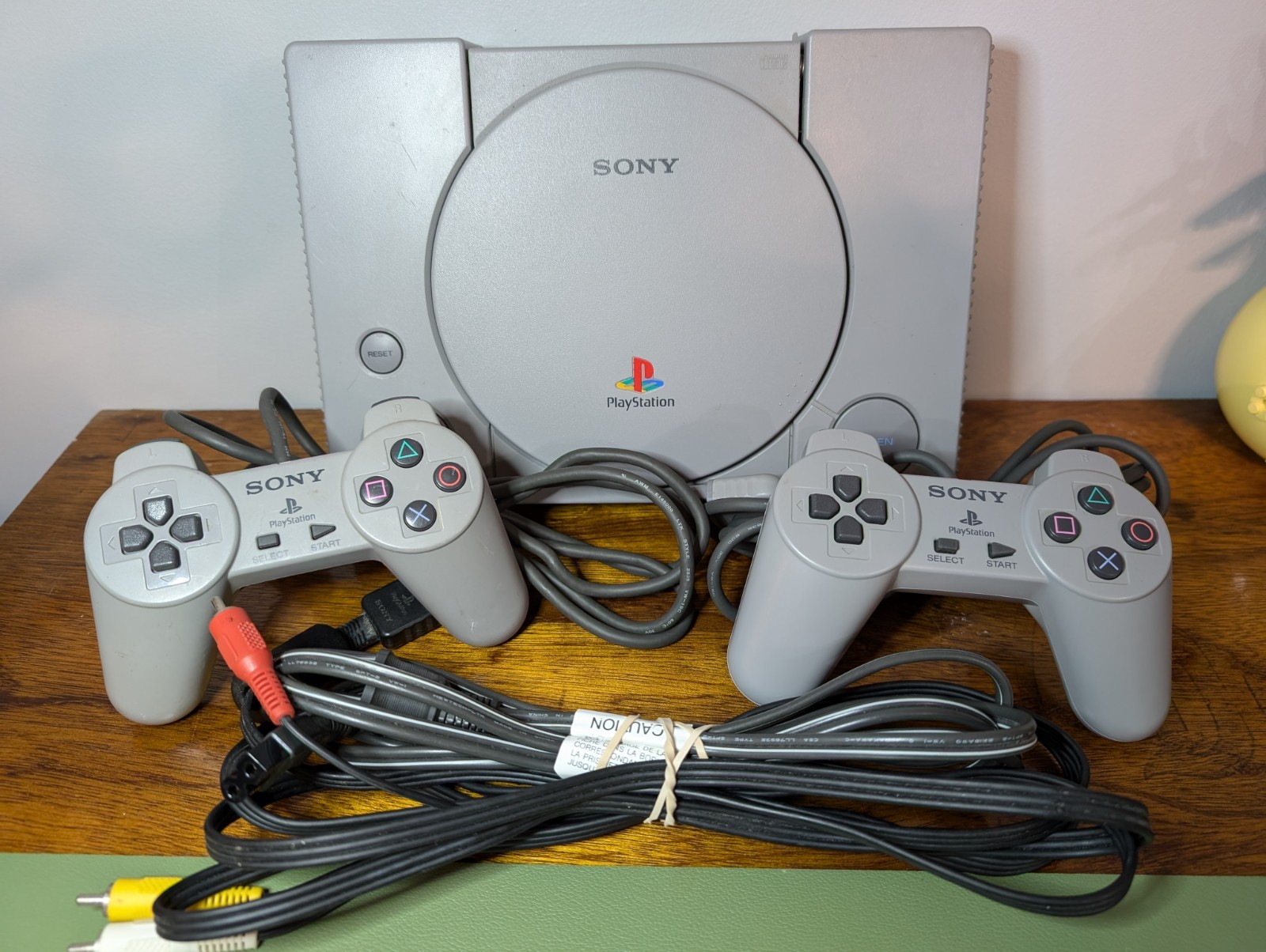 Sony PlayStation 1 Video Game Console, Cable, & Two Controllers – Gray SCPH-5501