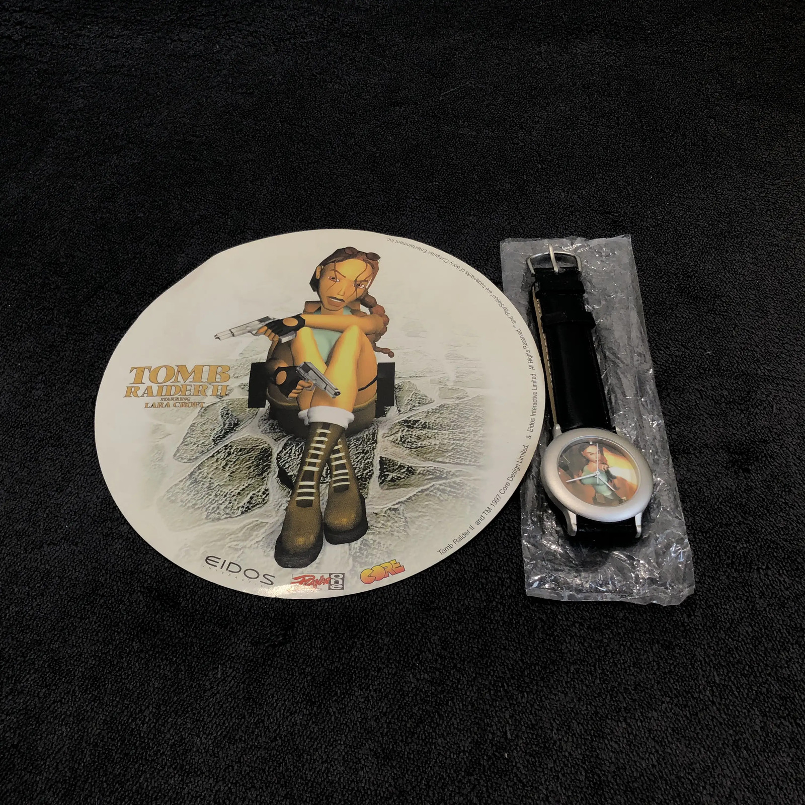 PS1 Sticker + Watch Collector Tomb Raider II Eur Spring Song Great Condition