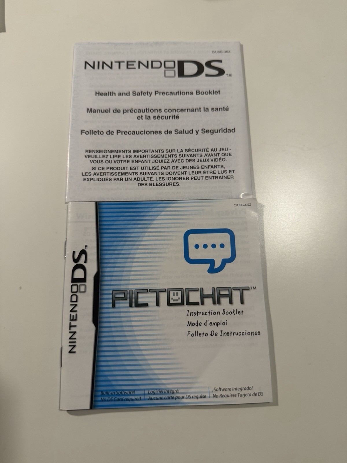 Nintendo DS Lite Metallic Rose System With Charger, Original Box, And 2 Cases