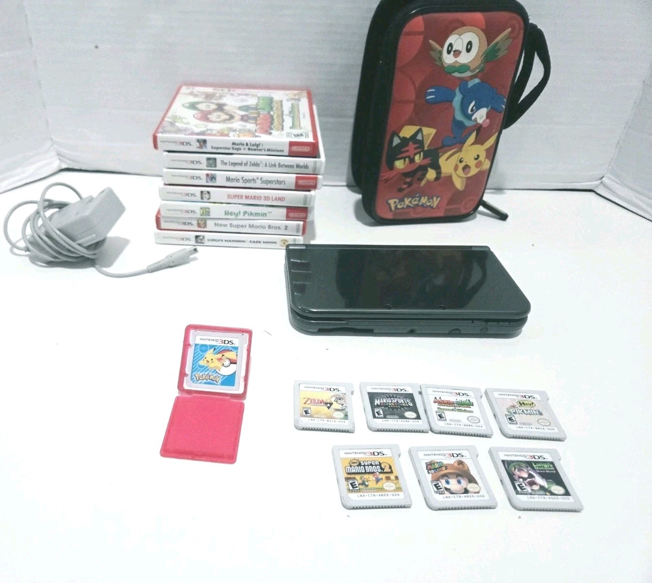 New Nintendo 3DS XL Black With 8 Games, Case, Stylus and Charger – WORKS