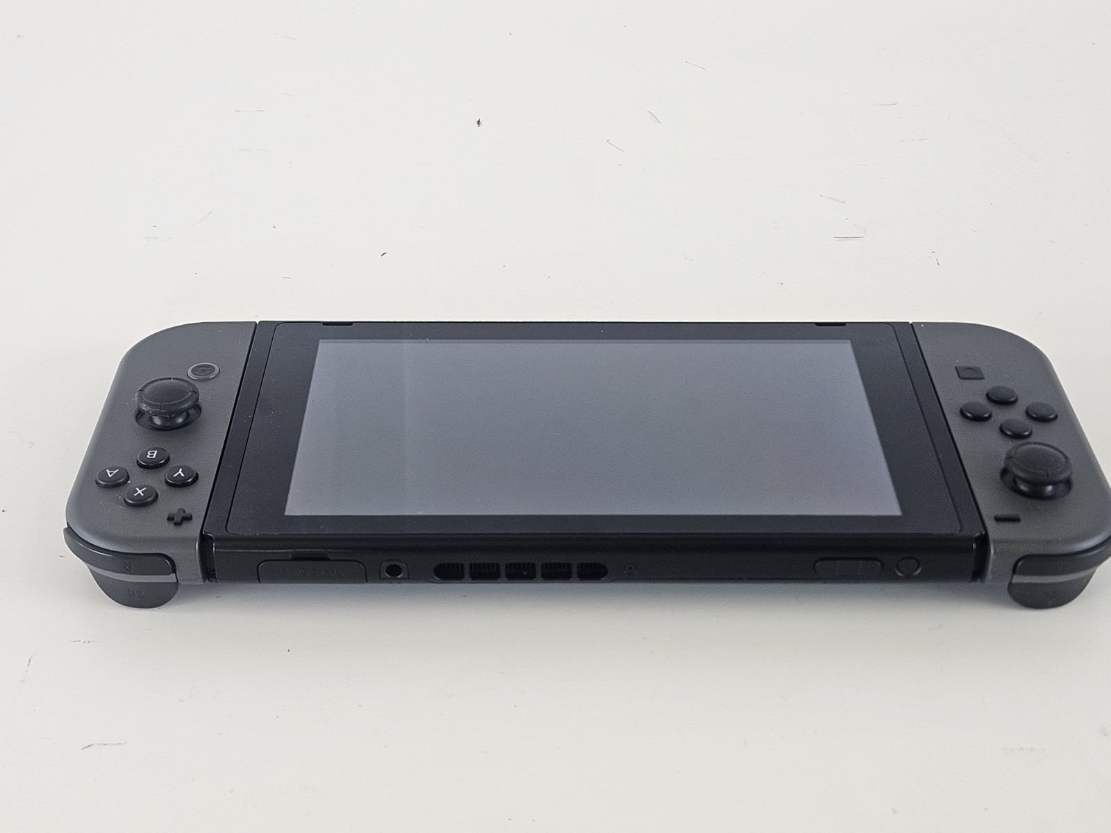 NINTENDO SWITCH HANDHELD – HAC-001 + OEM Charger – Tested