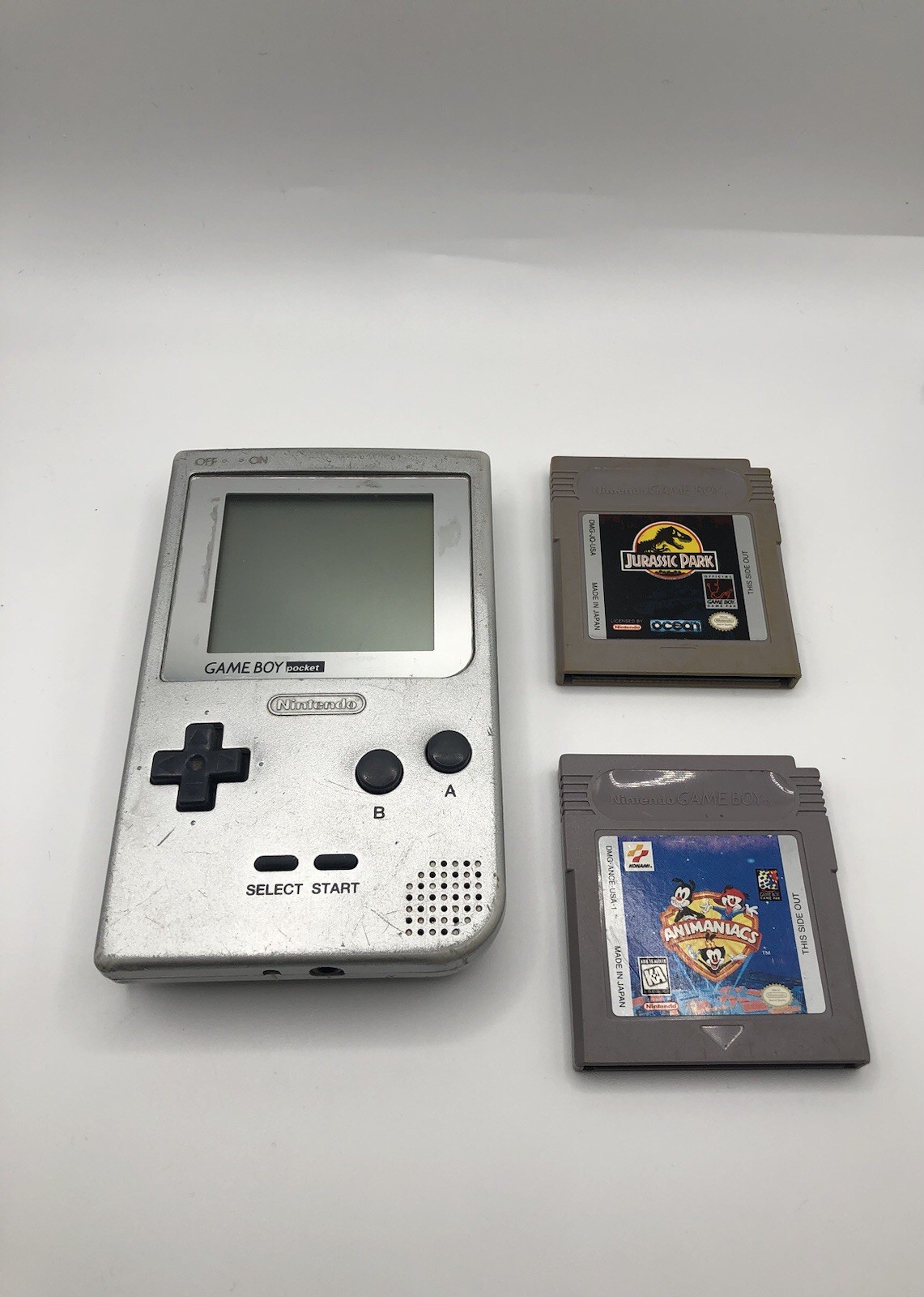 Silver Game Boy Pocket W/ Wall Charger, Animaniacs And Jurassic Park, Great Cond
