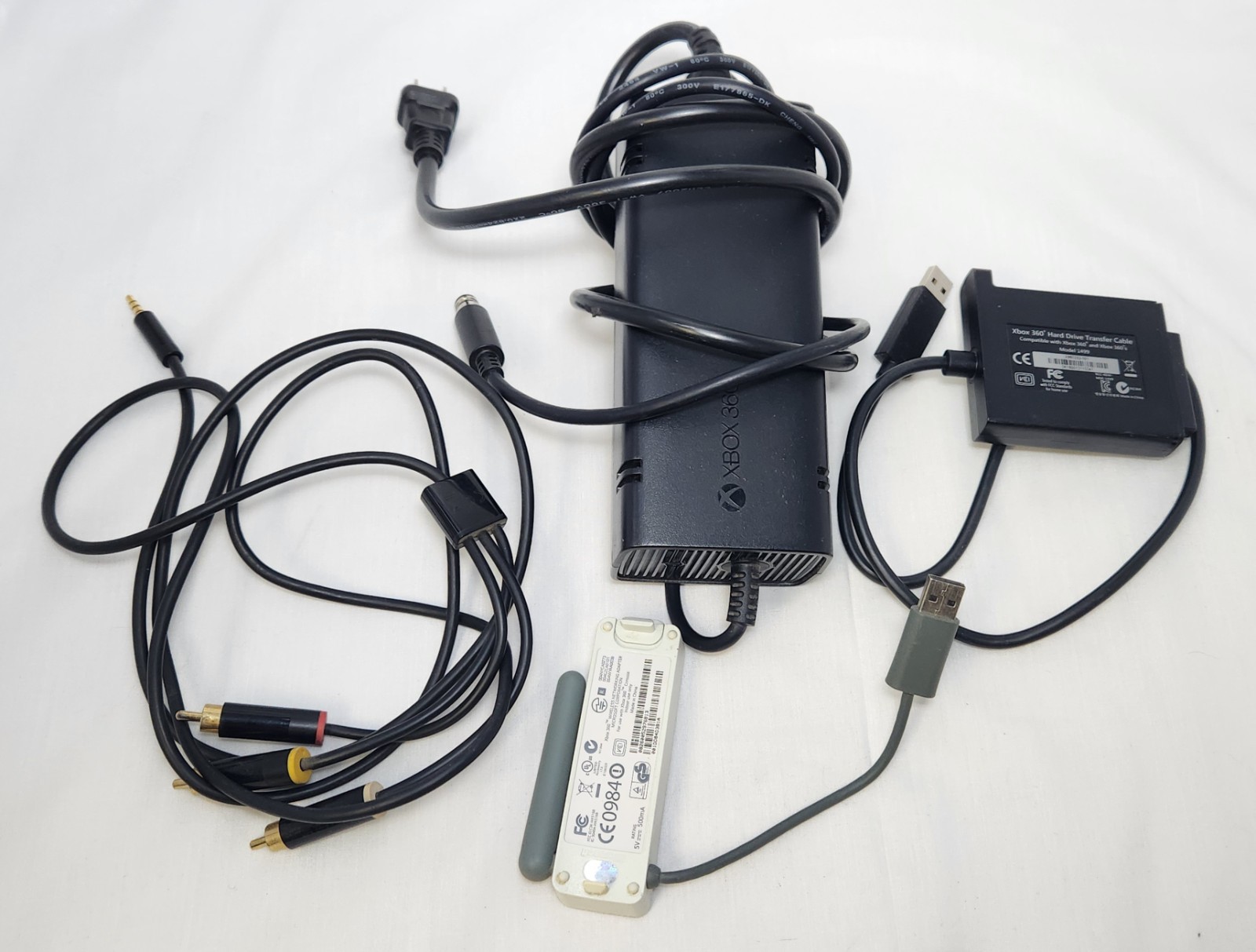 Xbox 360 E (Model 1538) with 12 Games + 4 Controllers – Works