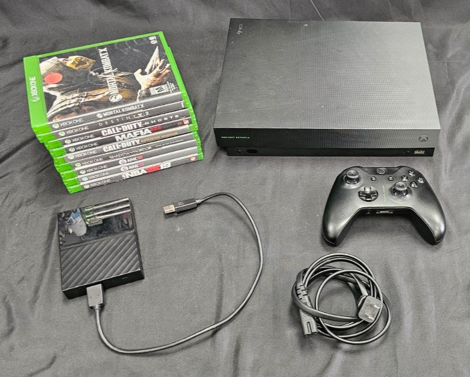 Microsoft Xbox One X with 1 controller, 4TB External Hard Drive, & 9 Games