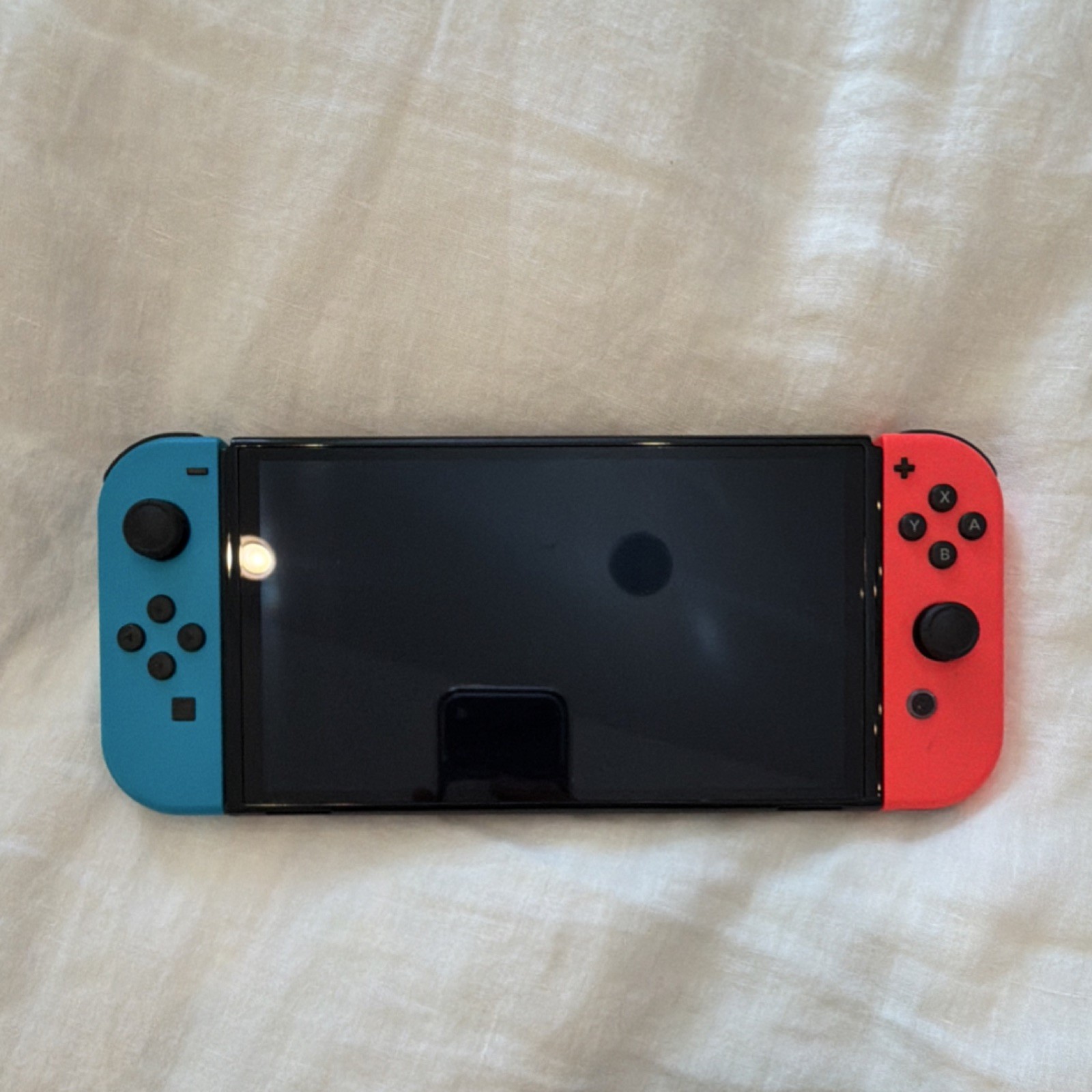 Nintendo Switch Oled In Black With Red And Blue Joy-Con