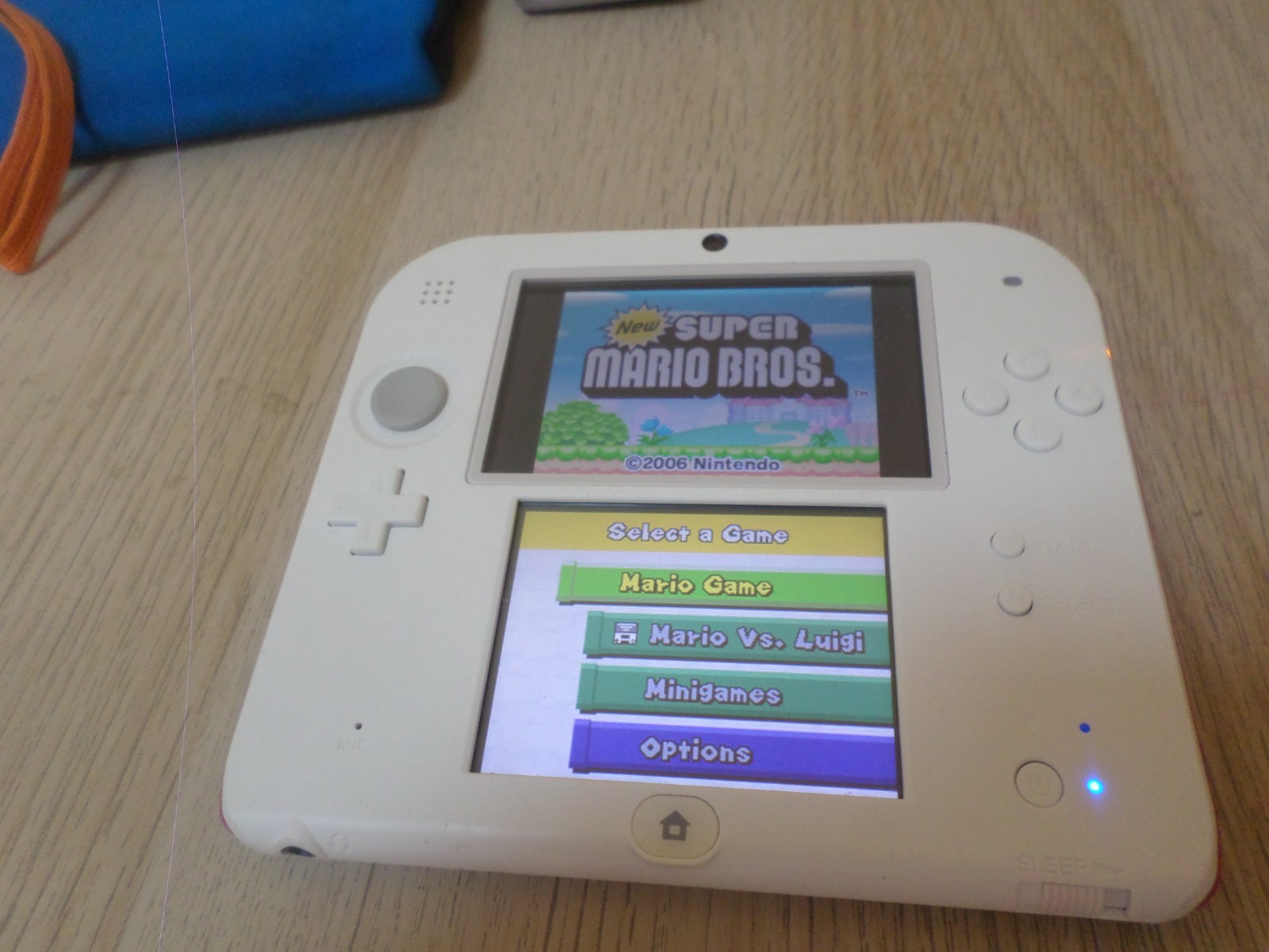 Nintendo 2DS White Red Console Bundle – 4 Games, Charger, Case, Stylus, 4GB SD
