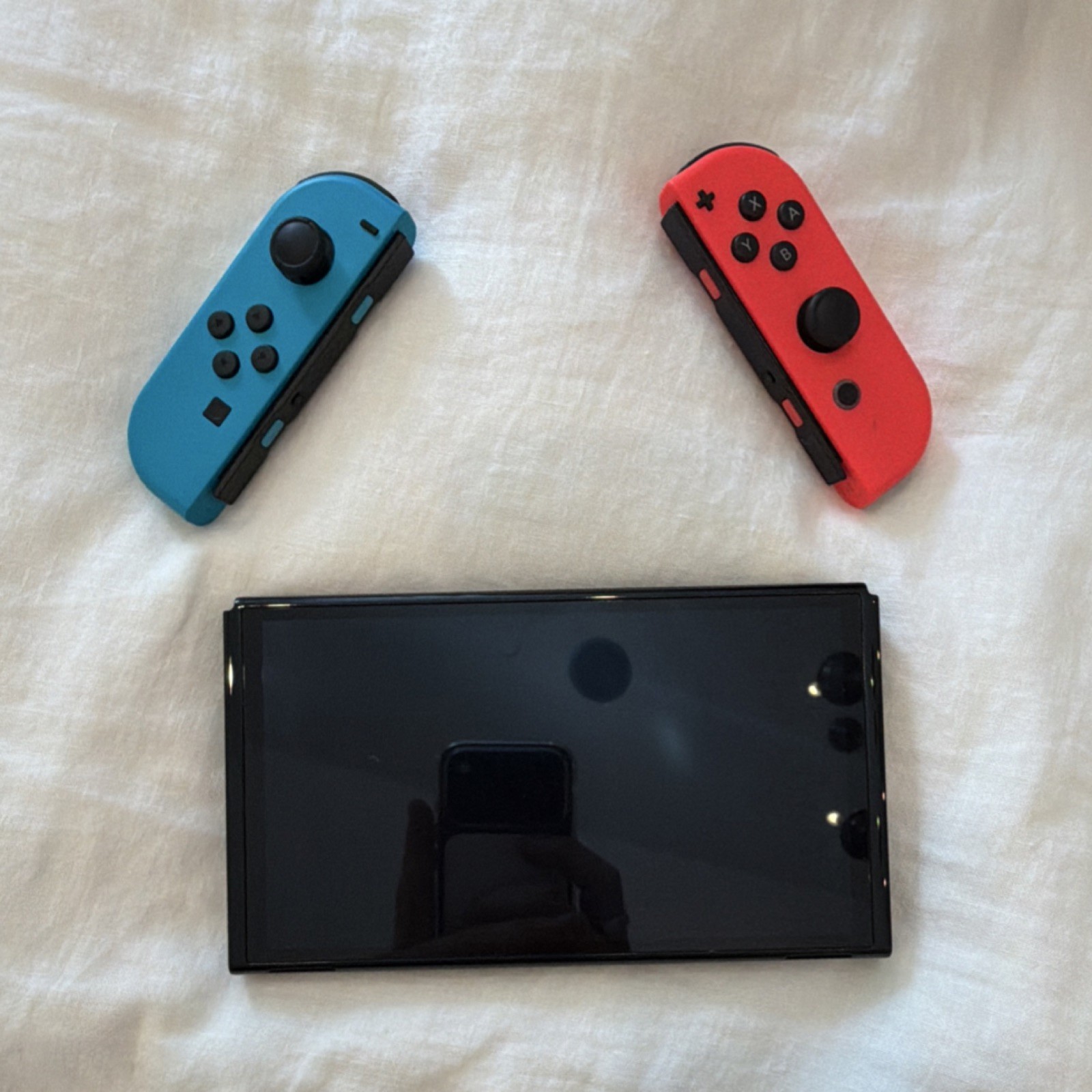 Nintendo Switch Oled In Black With Red And Blue Joy-Con