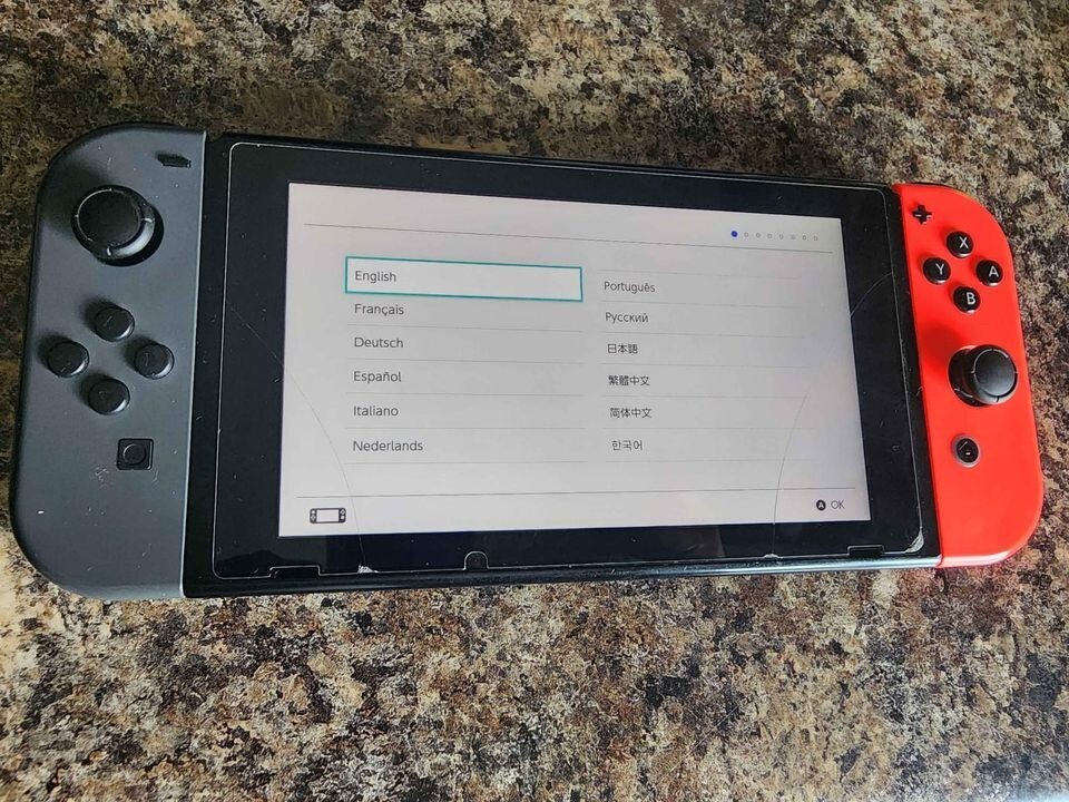 Used Nintendo Switch red and grey controller bundle