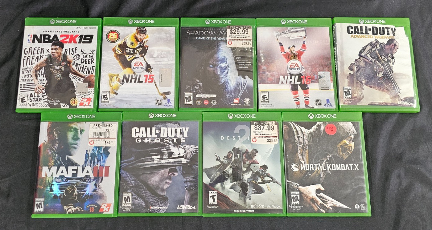 Microsoft Xbox One X with 1 controller, 4TB External Hard Drive, & 9 Games