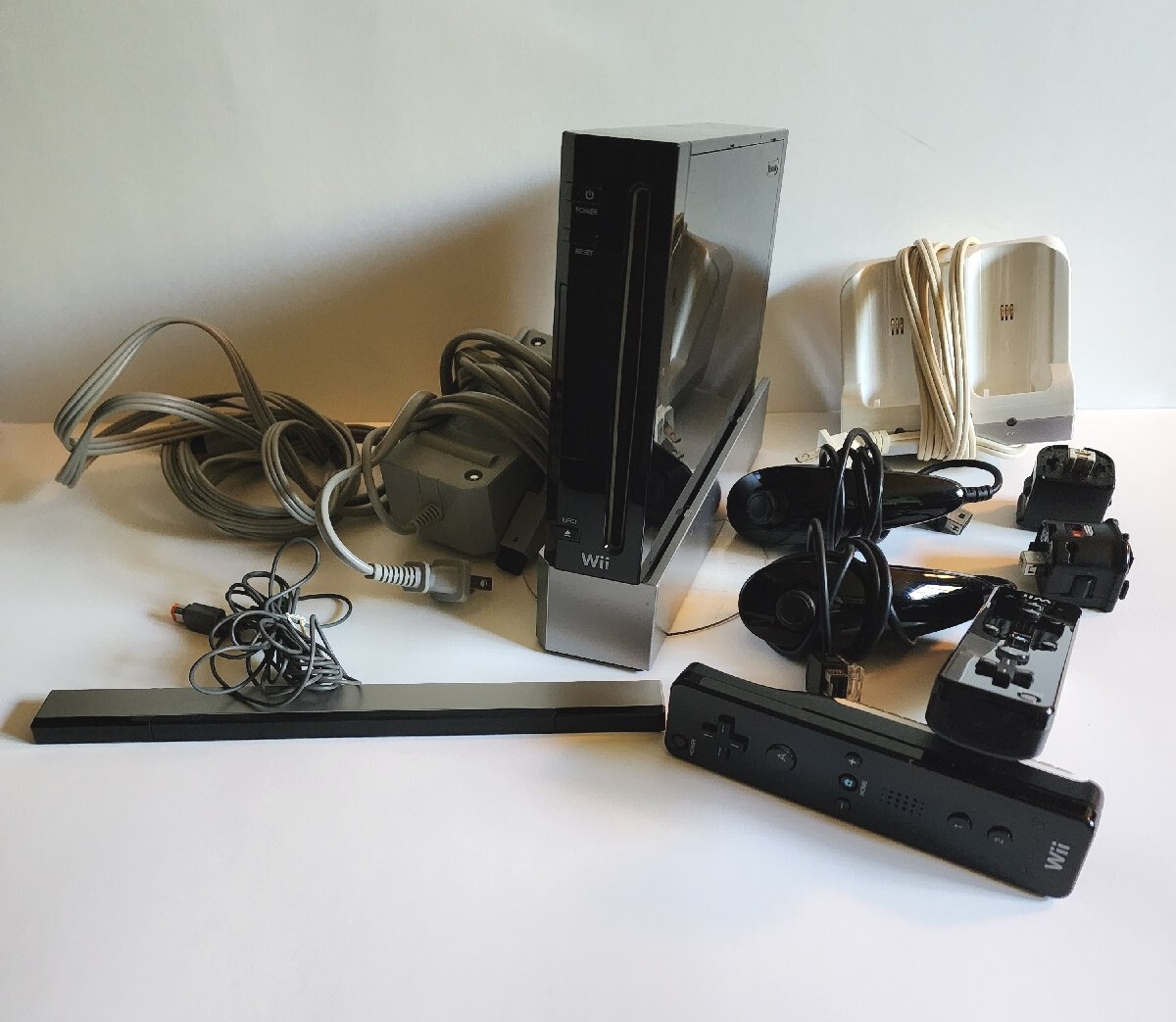 Nintendo Wii Black, 2 Wii Remote Plus, Charger Base With Assorted Games As Seen