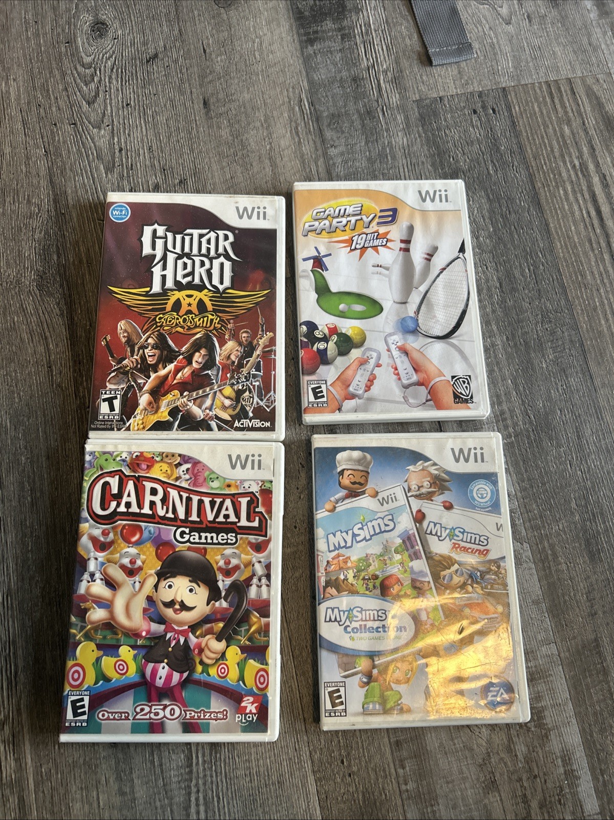 Lot Of 4 Wii Games, Guitar Hero, Game Party, MySims, Carnival