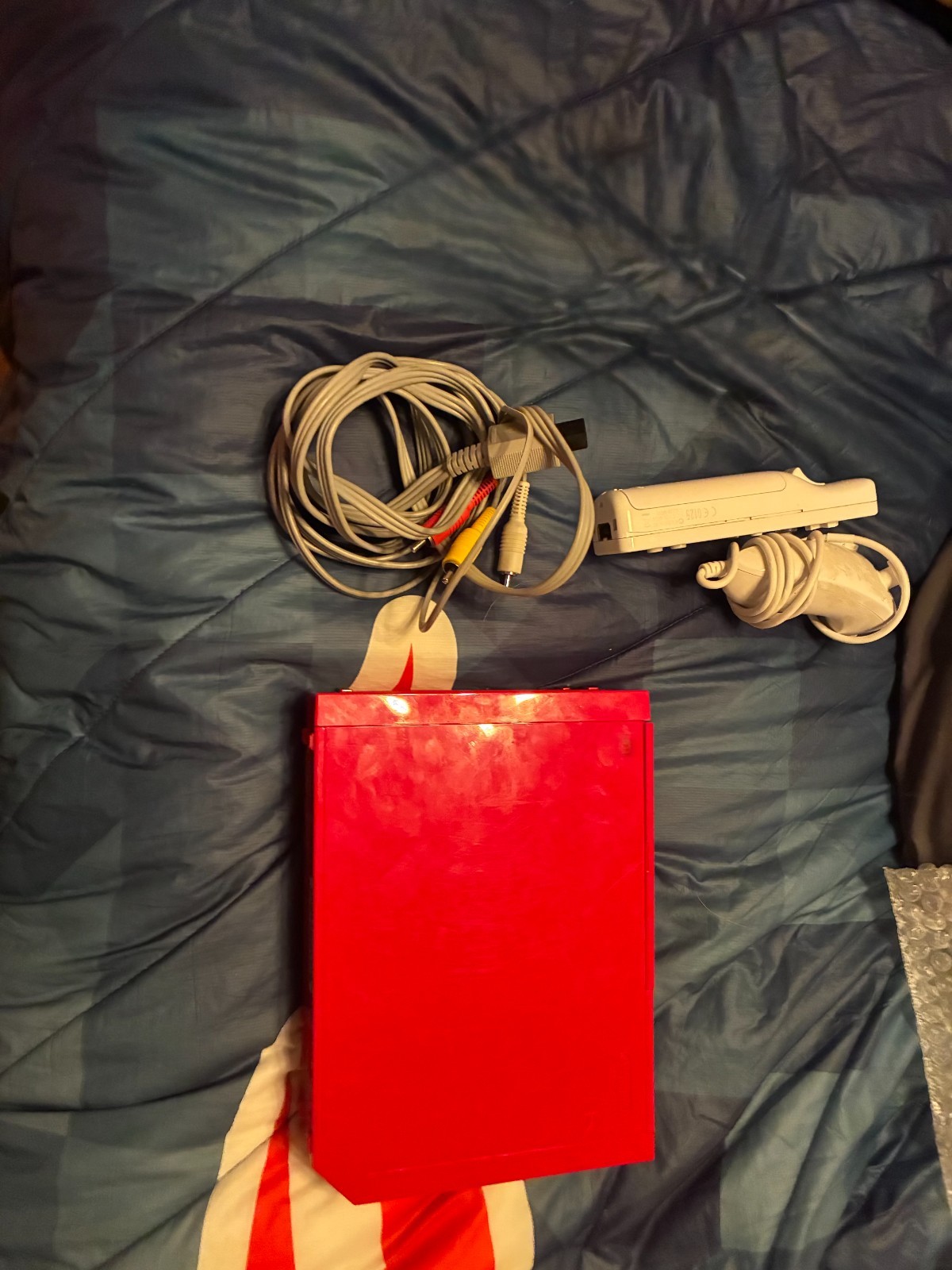 red wii console bundle: white controller,white nunchuck,tv av cable, sensor bar