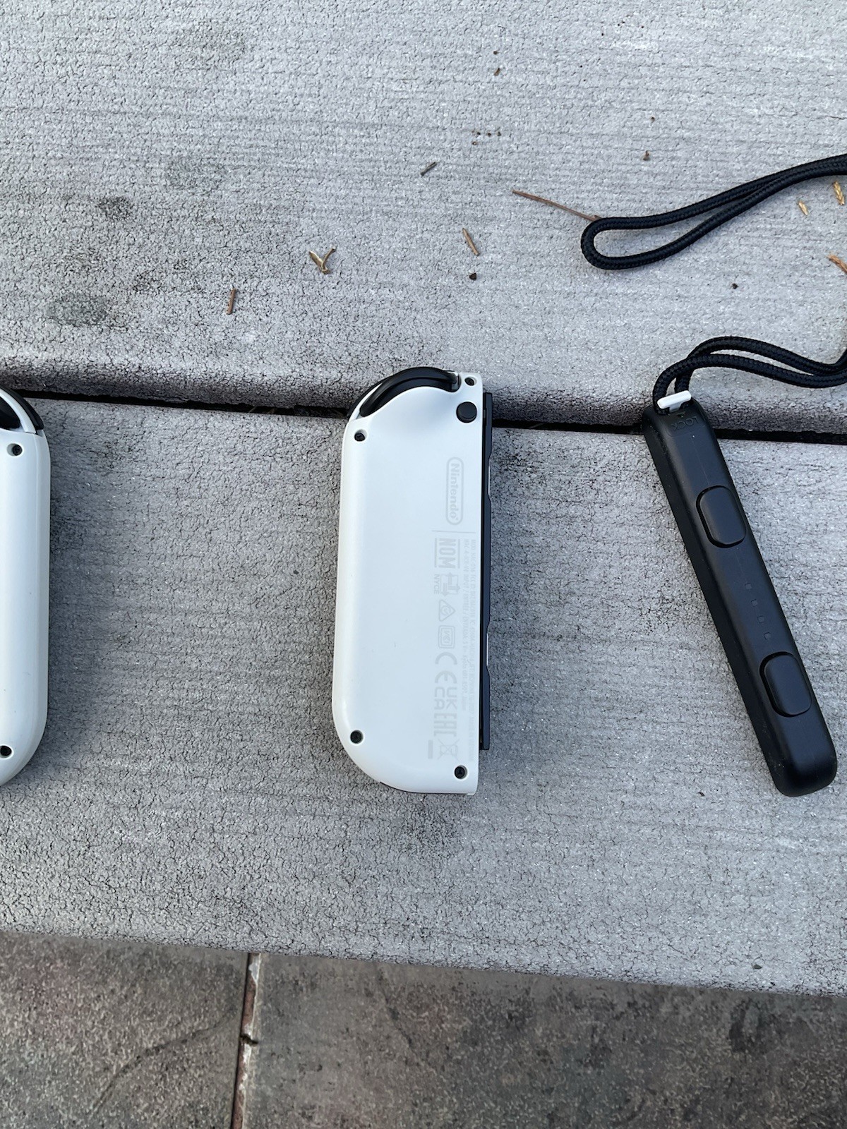 White Joycons with Straps And Grip. OLED White Nintendo Joycons