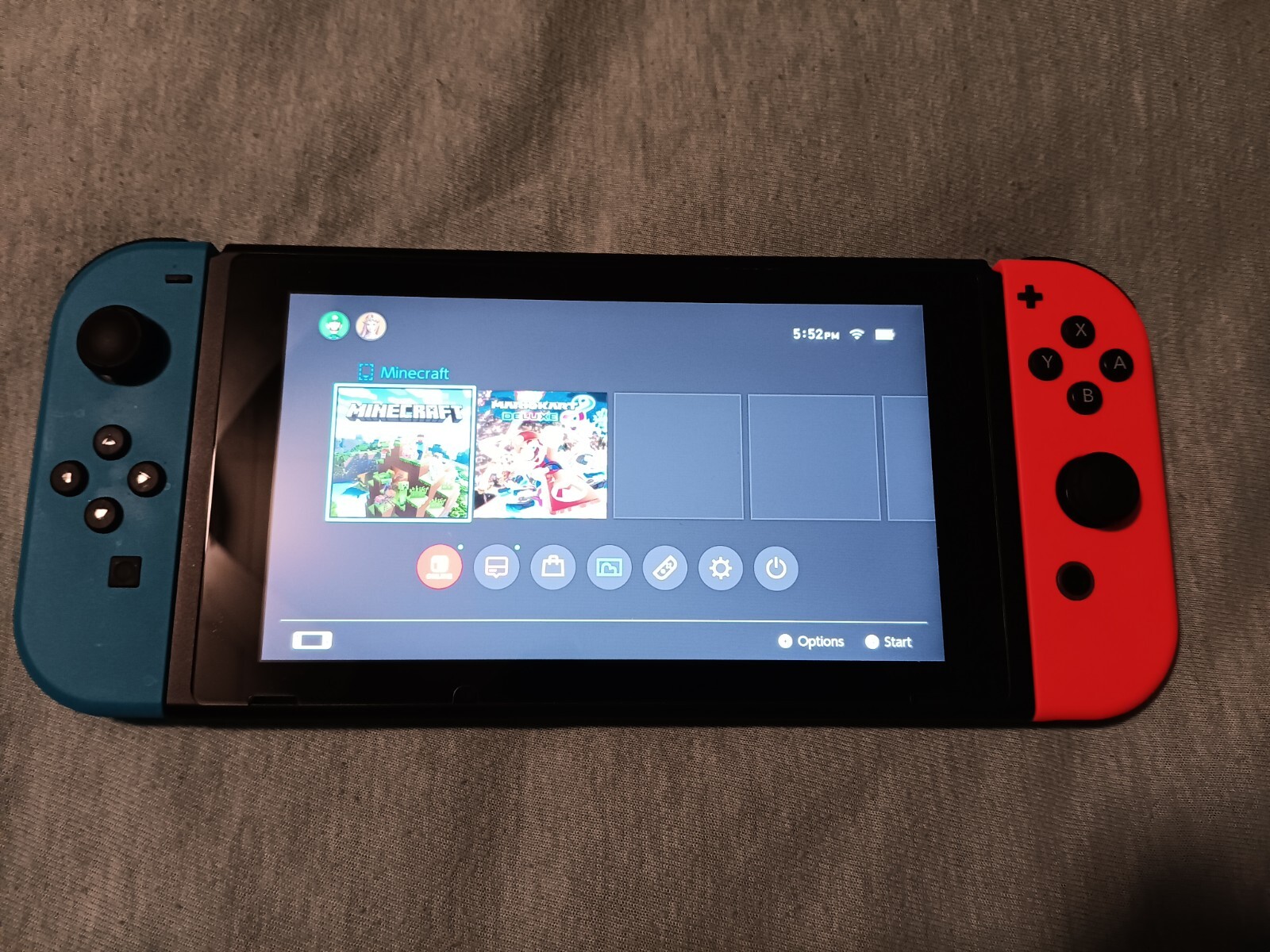 Nintendo Switch. Blue and red controller.