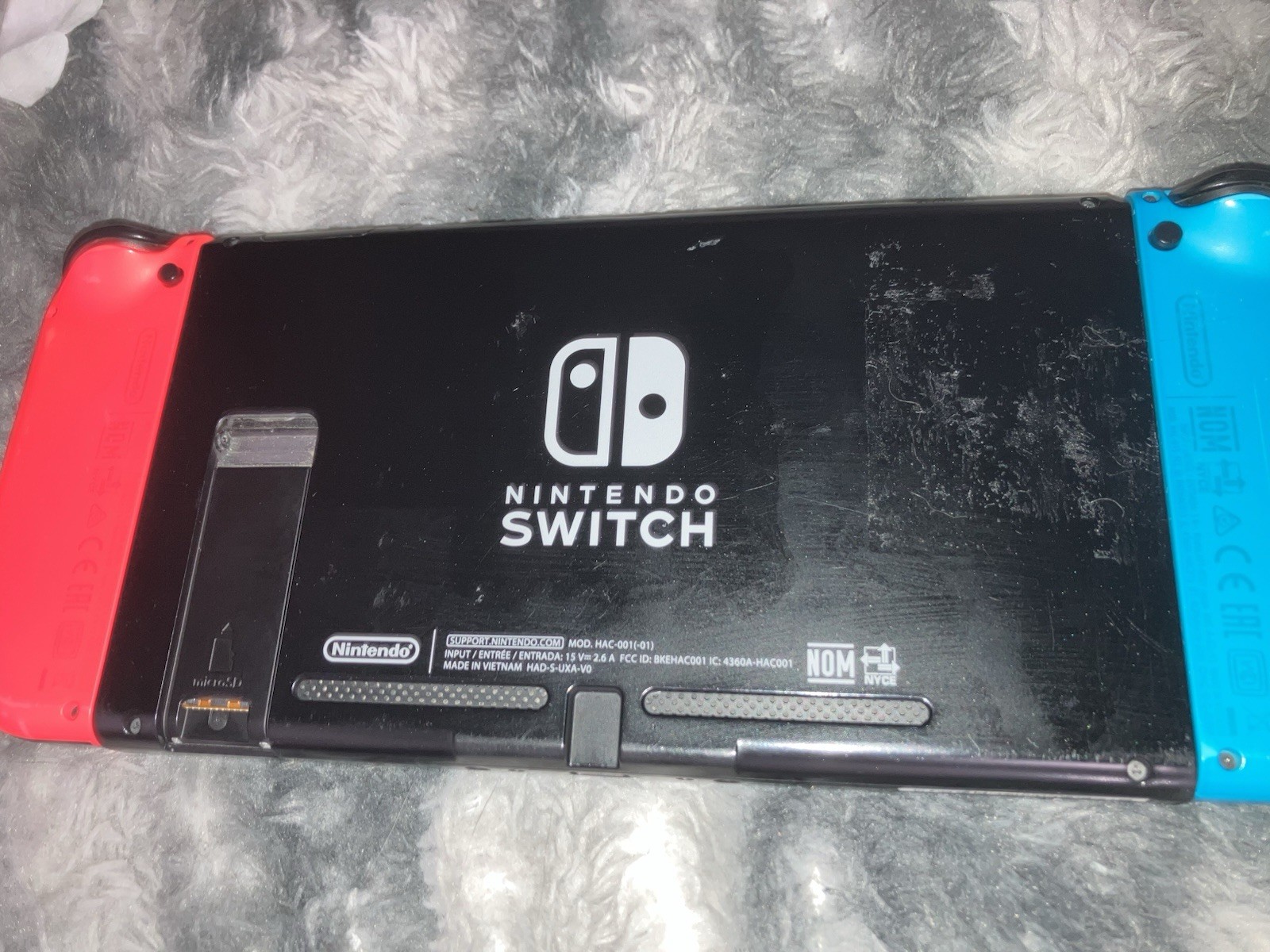 Nintendo Switch Console w/ Dock, Blue/Red Joy-Con, Grip, AC Adapter, & Case