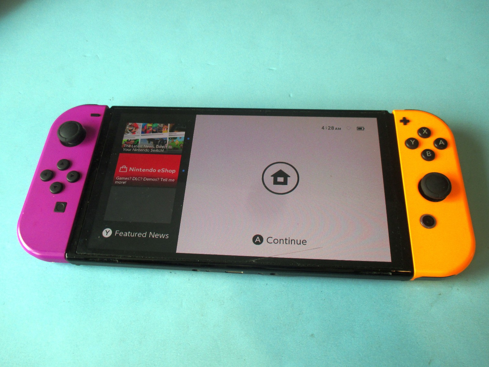 Nintendo Switch OLED System Black Console w/Purple & Orange Joy-Cons + Case