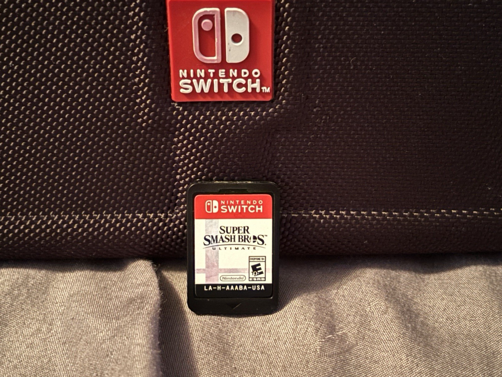 Nintendo Switch, 2 controllers don’t know if they work), bag, and smash bros